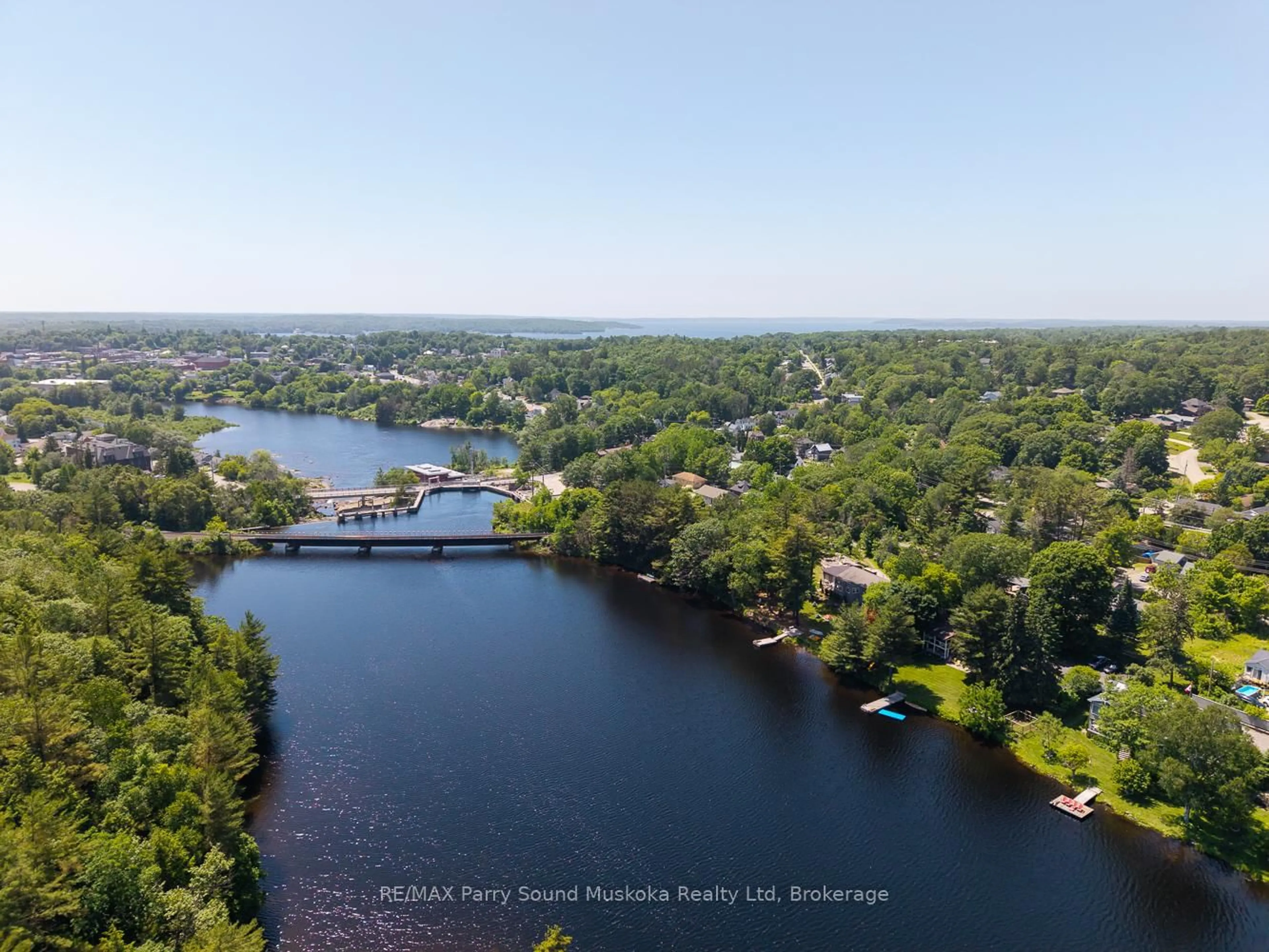 A pic from outside/outdoor area/front of a property/back of a property/a pic from drone, water/lake/river/ocean view for 9 Addie St, Parry Sound Ontario P2A 2J9