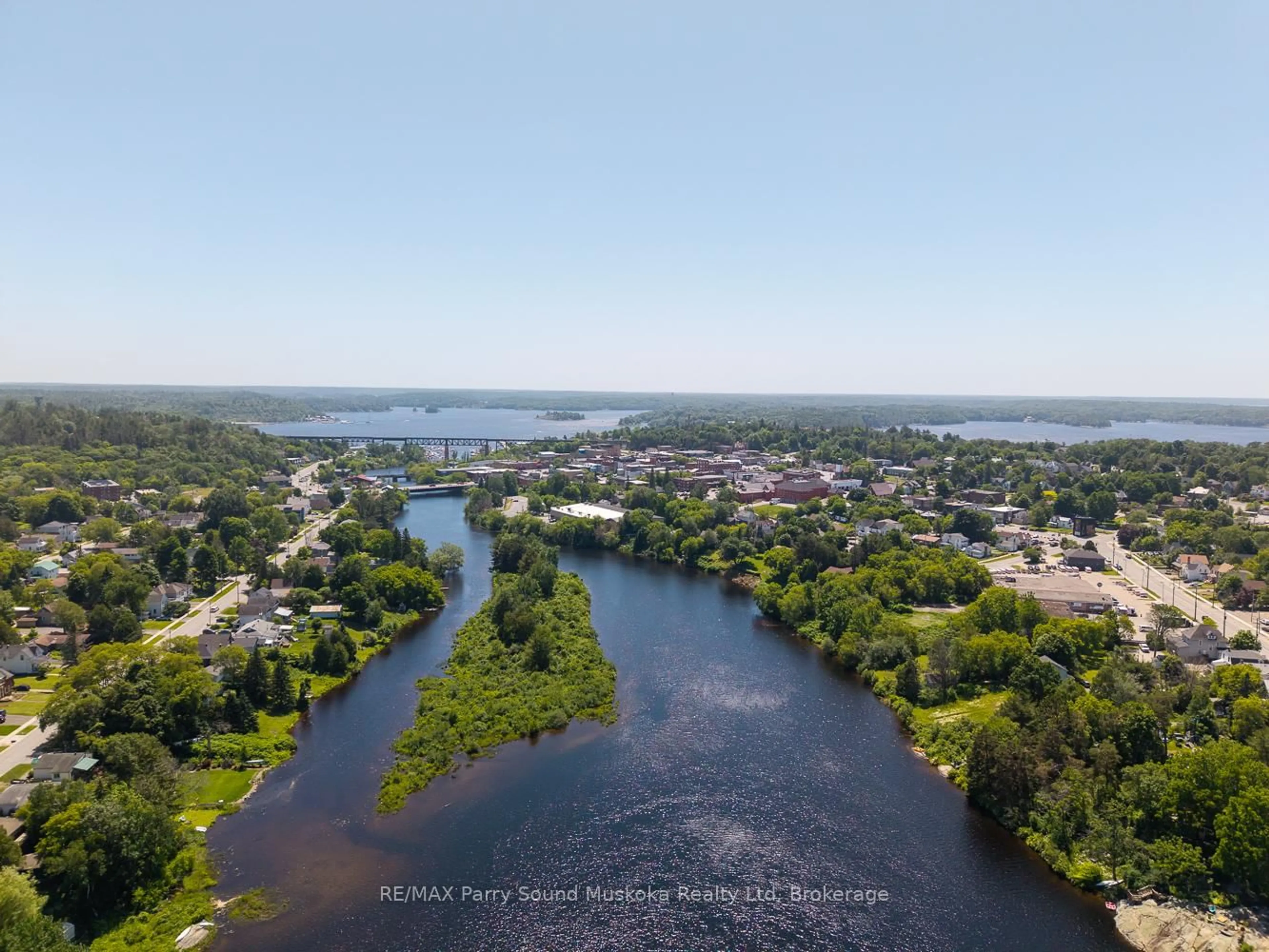 A pic from outside/outdoor area/front of a property/back of a property/a pic from drone, water/lake/river/ocean view for 9 Addie St, Parry Sound Ontario P2A 2J9