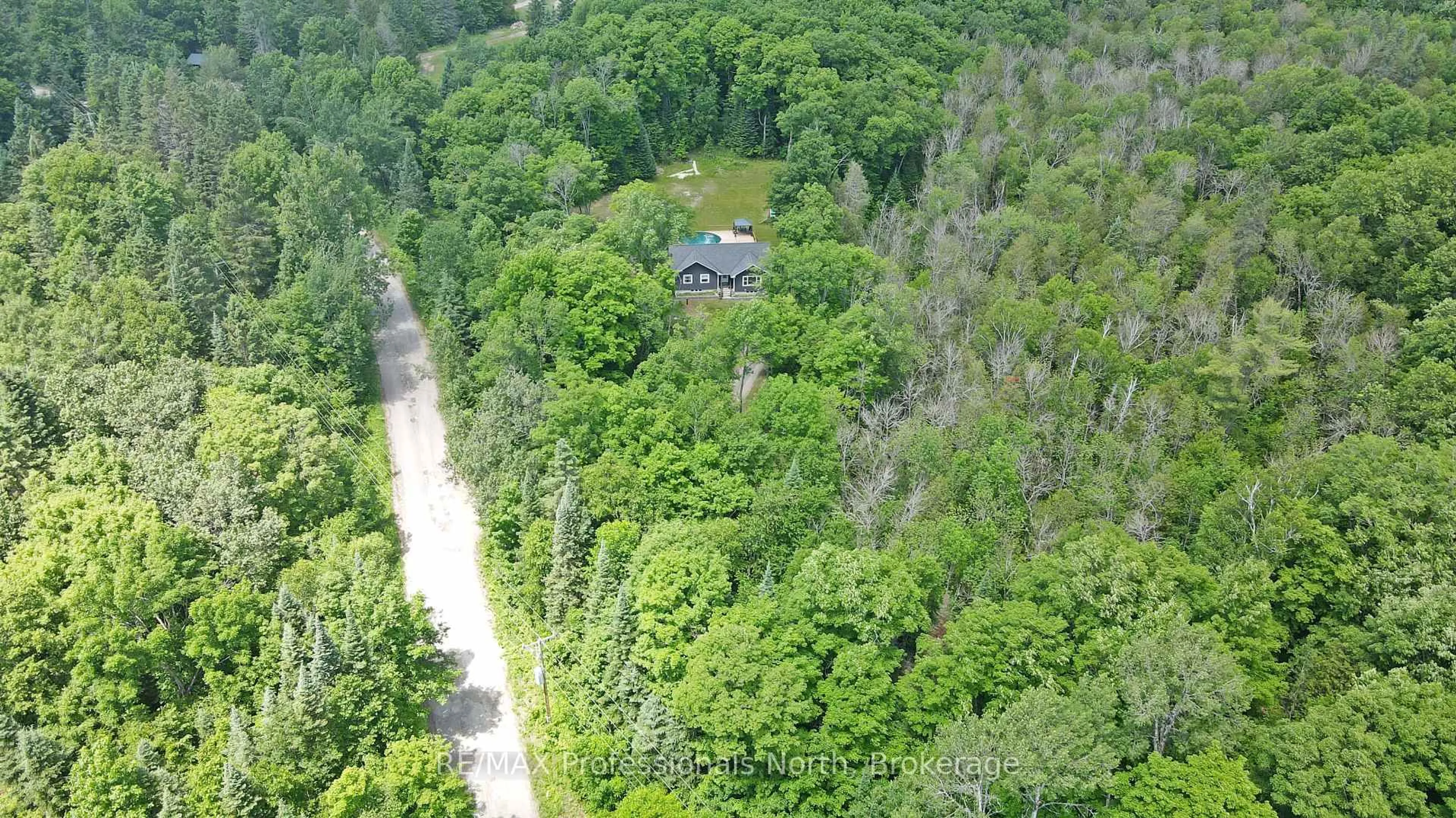 A pic from outside/outdoor area/front of a property/back of a property/a pic from drone, forest/trees view for 1979 Blairhampton Rd, Minden Hills Ontario K0M 2K0