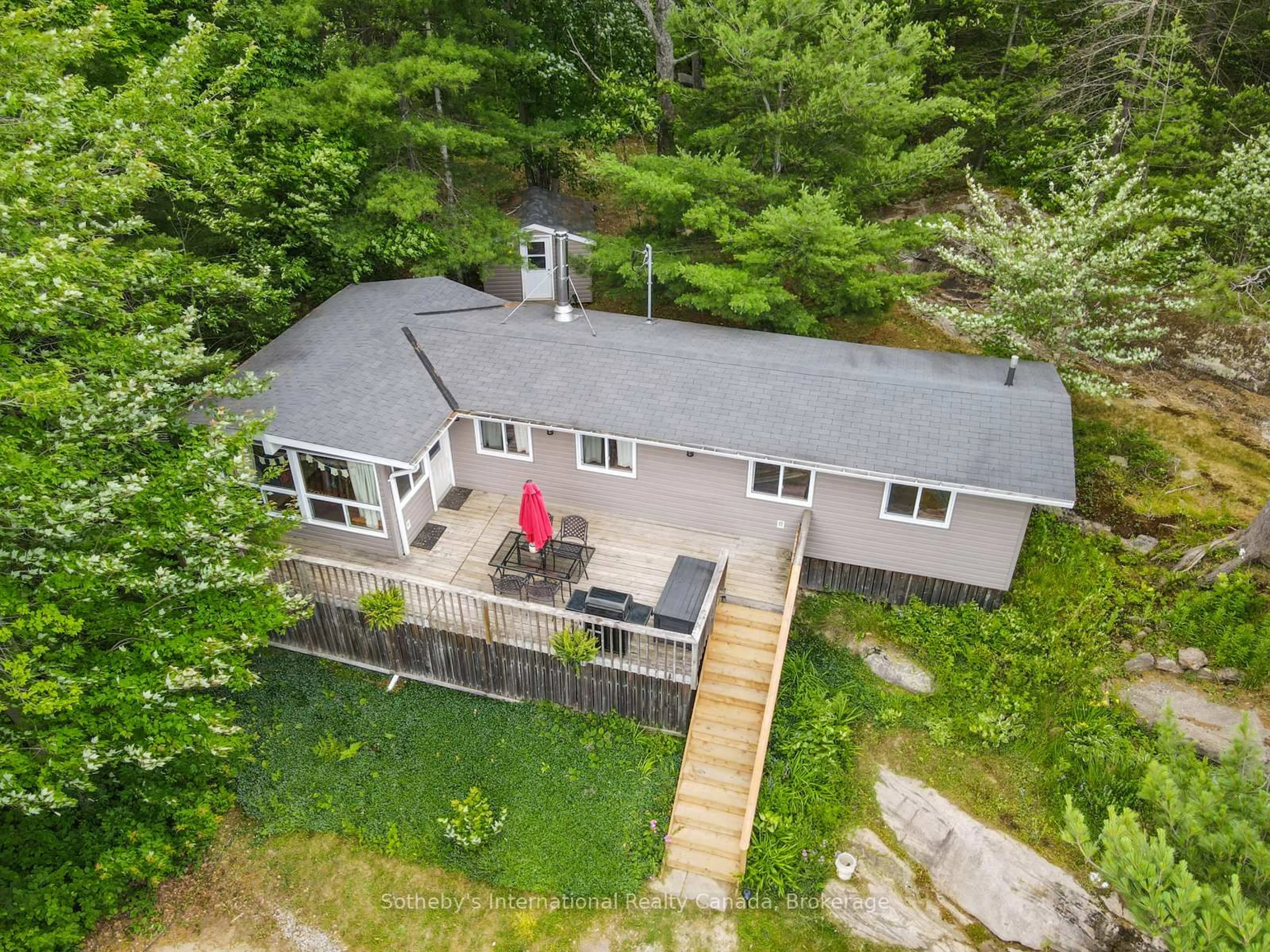 A pic from outside/outdoor area/front of a property/back of a property/a pic from drone, water/lake/river/ocean view for 1040 Kahshe Lake, Gravenhurst Ontario P0E 1G0