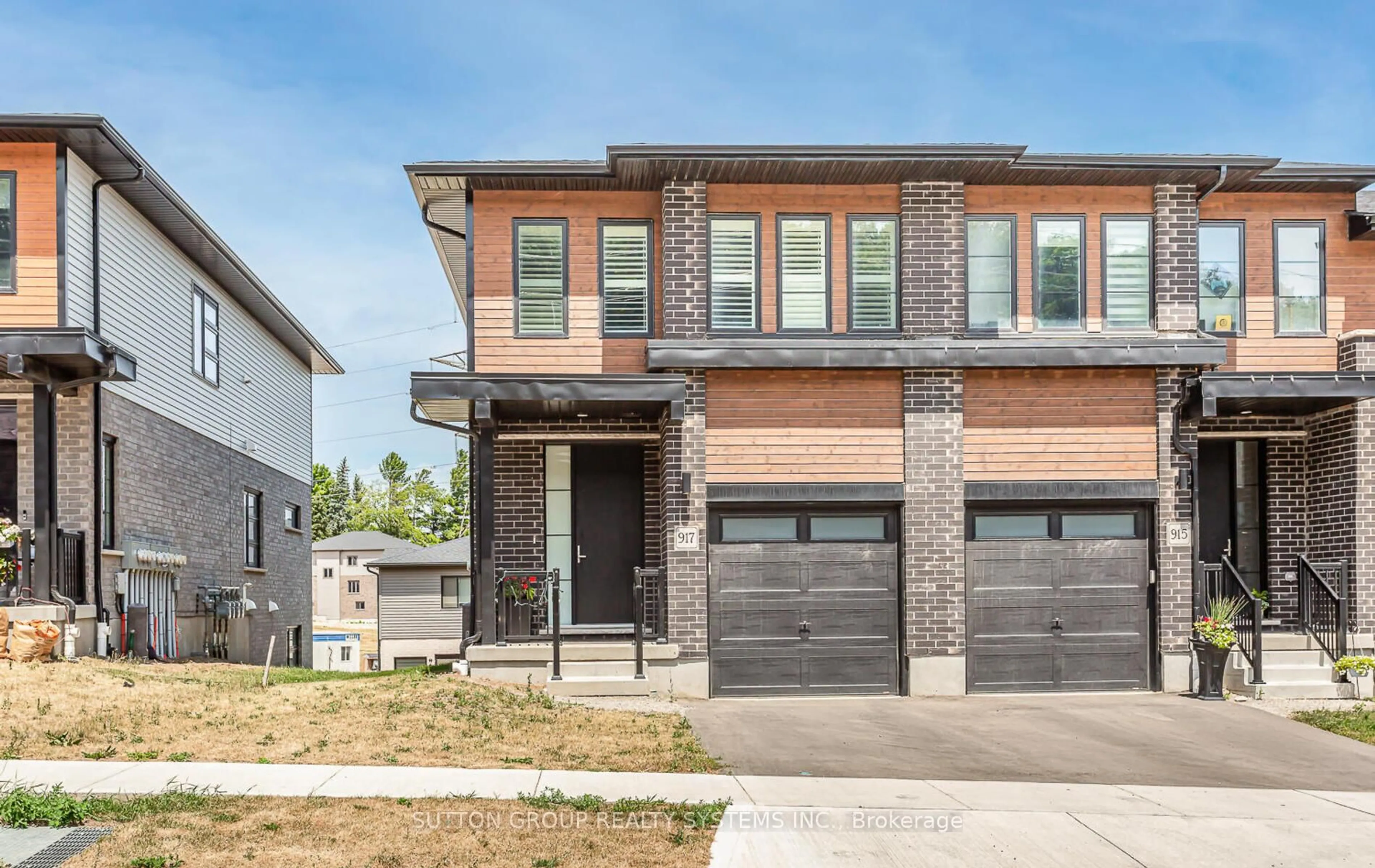 Home with brick exterior material, street for 917 Robert Ferrie Dr, Kitchener Ontario N2R 0P2