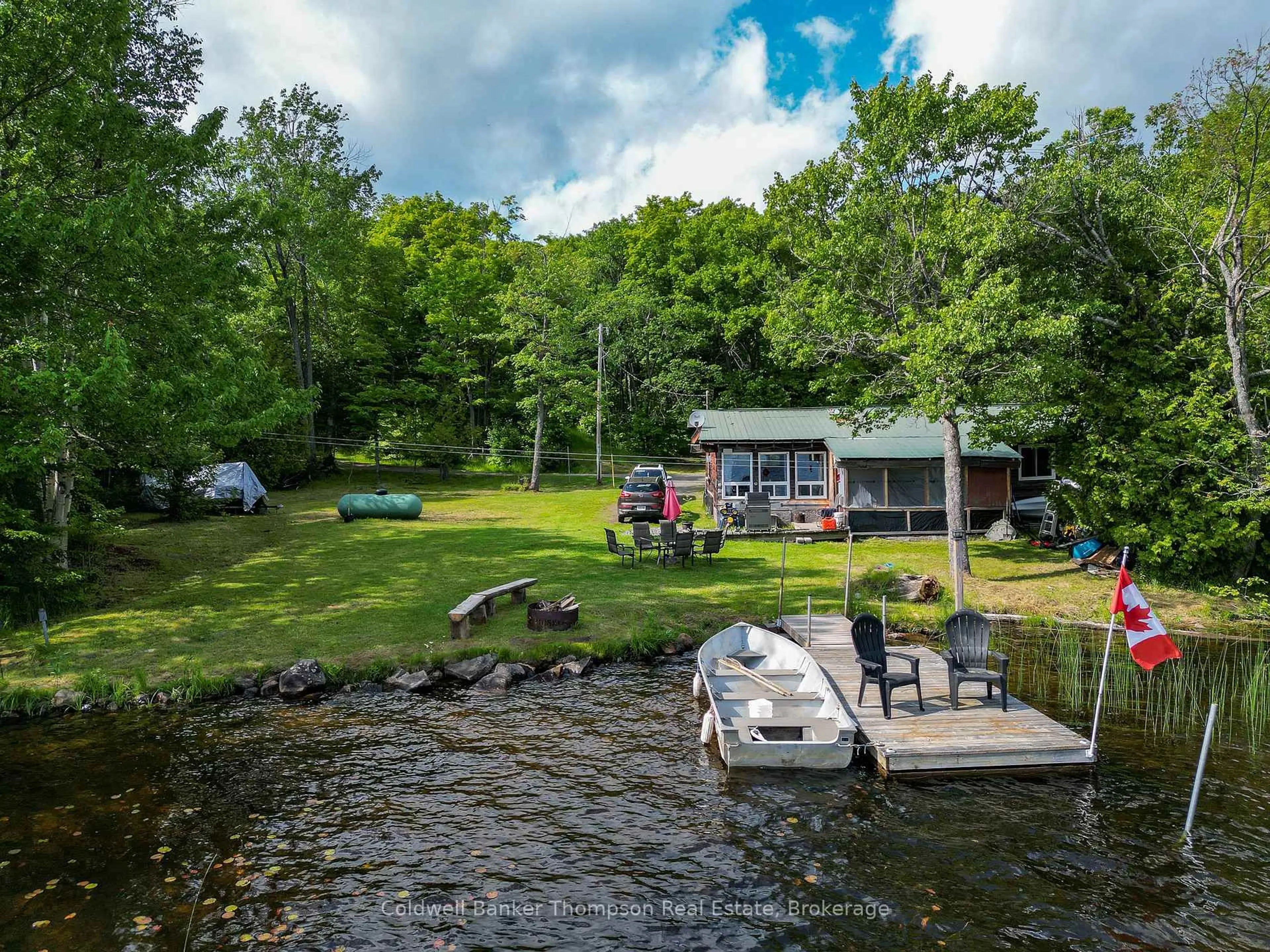 A pic from outside/outdoor area/front of a property/back of a property/a pic from drone, water/lake/river/ocean view for 369 Oudaze Lake Rd, Huntsville Ontario P1H 2J6