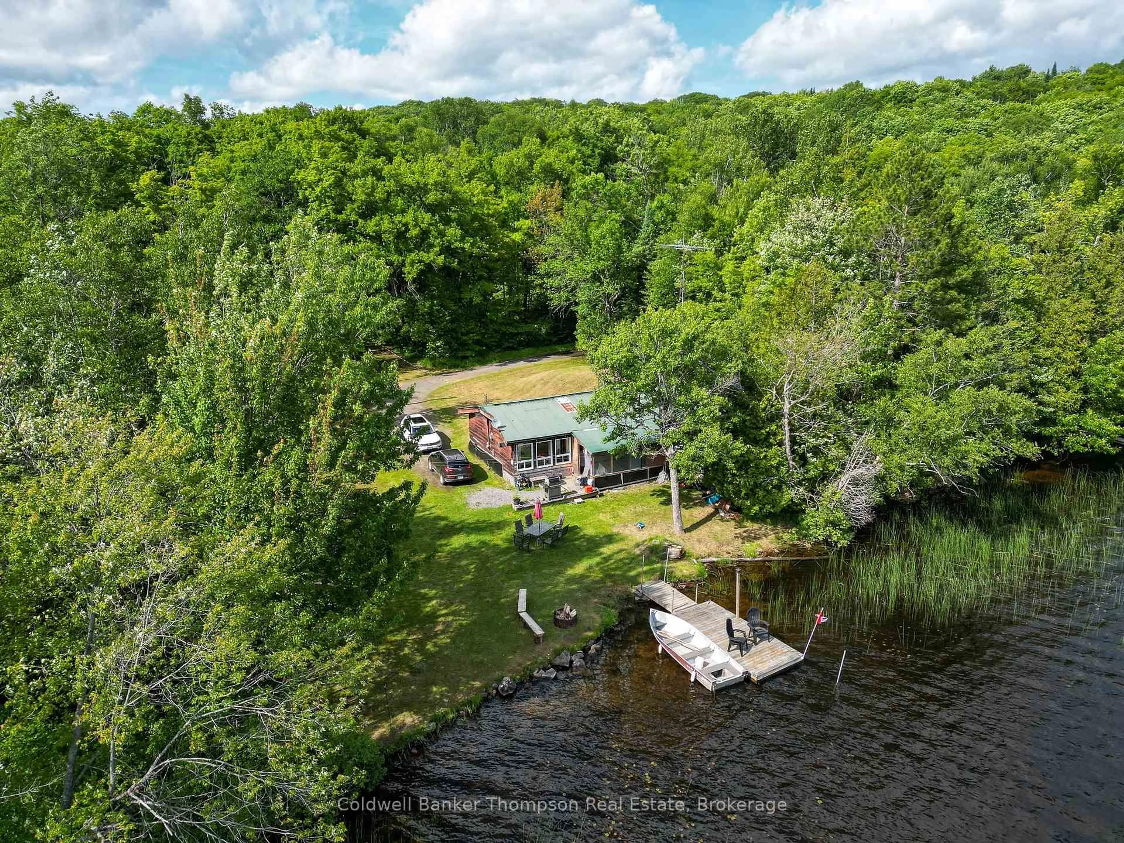A pic from outside/outdoor area/front of a property/back of a property/a pic from drone, water/lake/river/ocean view for 369 Oudaze Lake Rd, Huntsville Ontario P1H 2J6