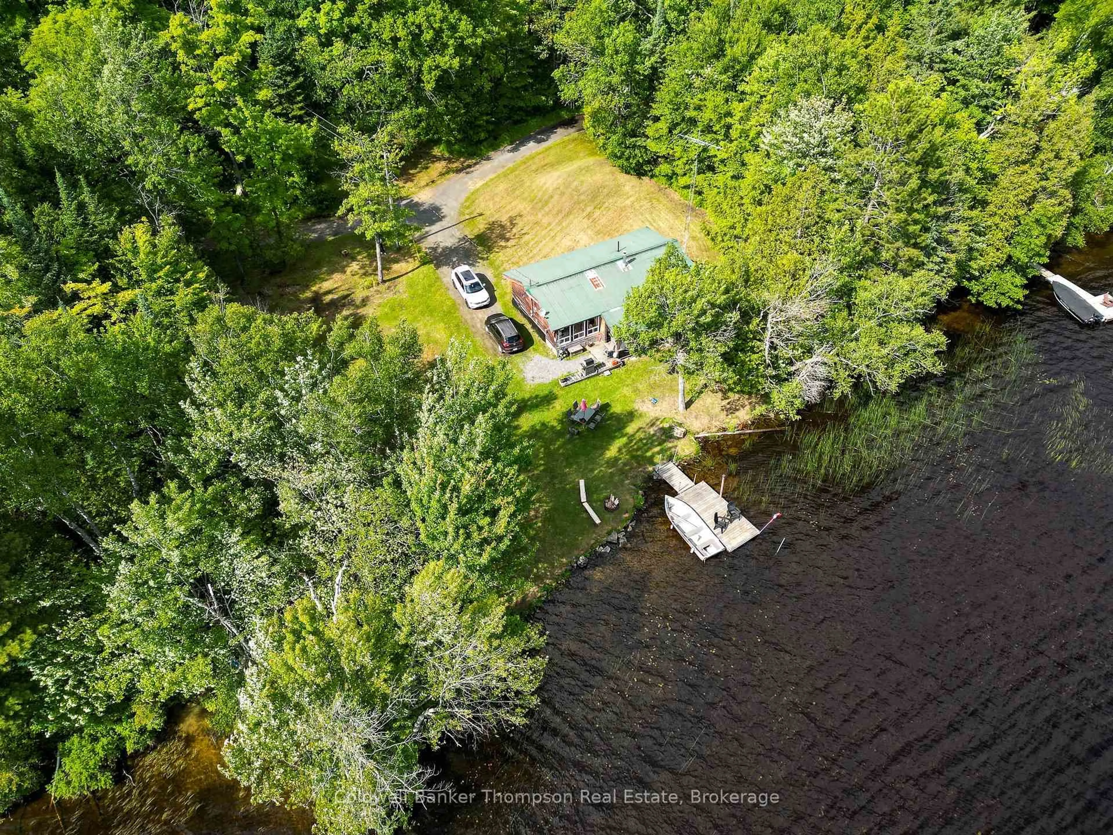 A pic from outside/outdoor area/front of a property/back of a property/a pic from drone, water/lake/river/ocean view for 369 Oudaze Lake Rd, Huntsville Ontario P1H 2J6