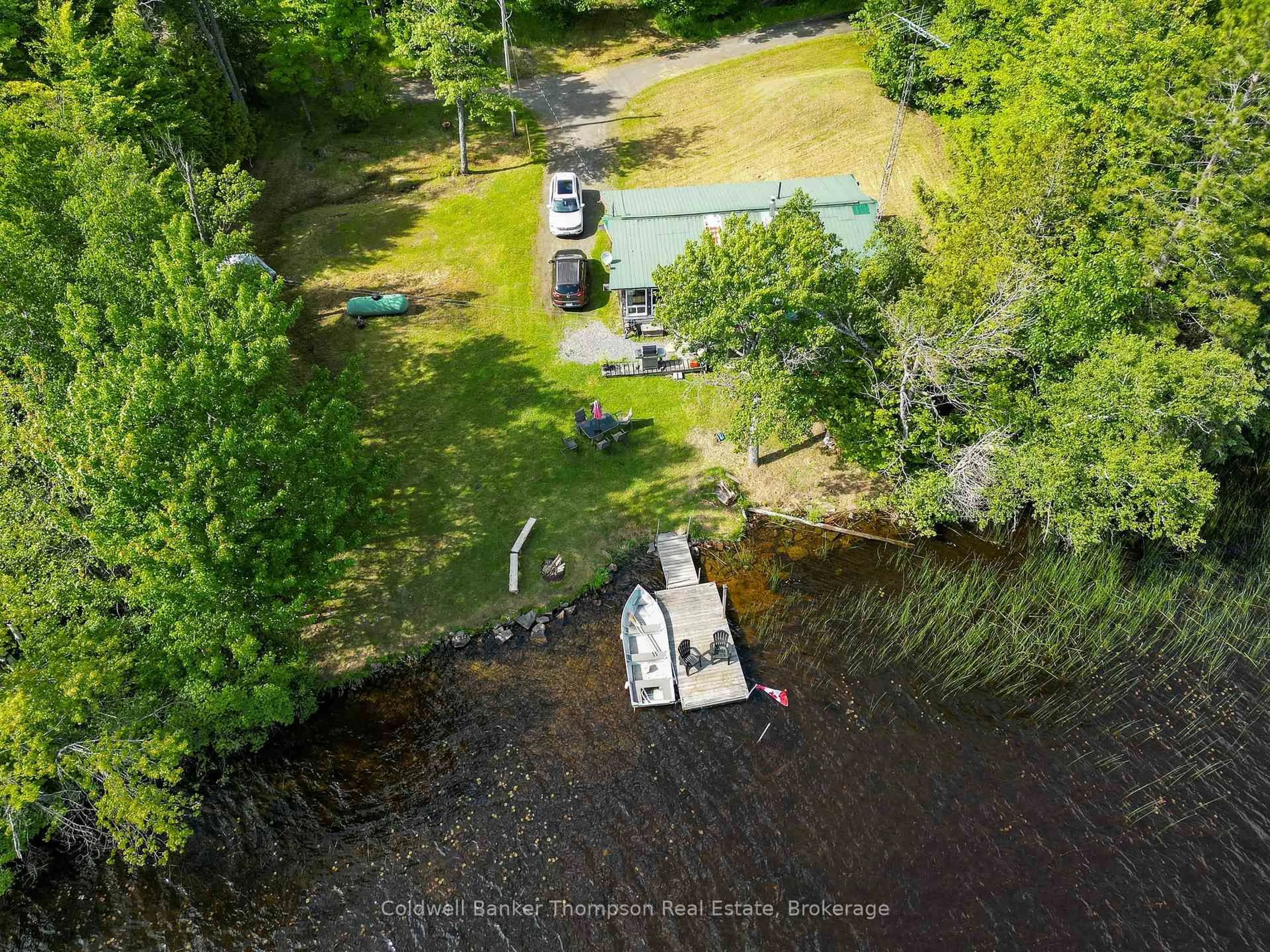 A pic from outside/outdoor area/front of a property/back of a property/a pic from drone, water/lake/river/ocean view for 369 Oudaze Lake Rd, Huntsville Ontario P1H 2J6