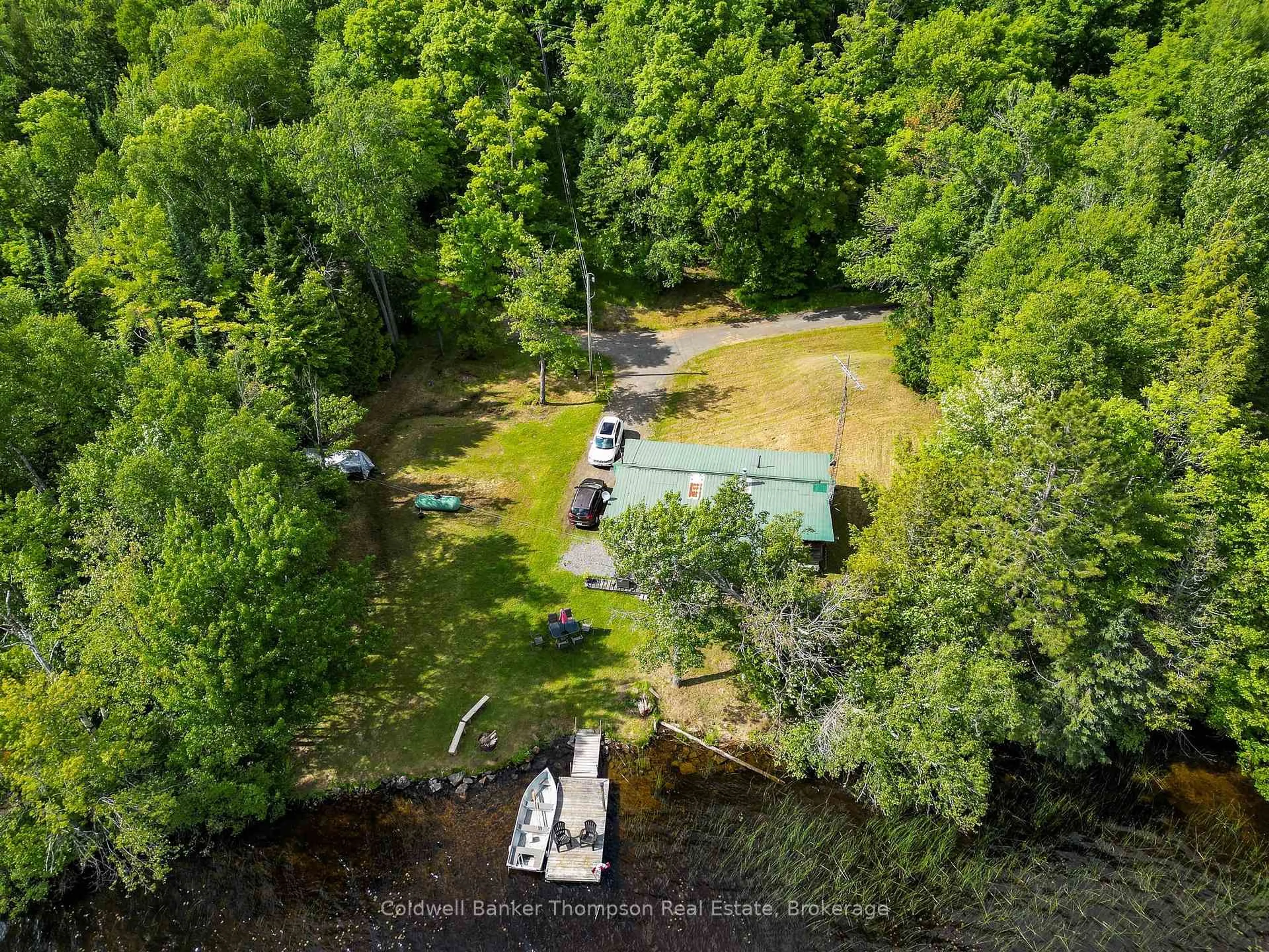A pic from outside/outdoor area/front of a property/back of a property/a pic from drone, water/lake/river/ocean view for 369 Oudaze Lake Rd, Huntsville Ontario P1H 2J6