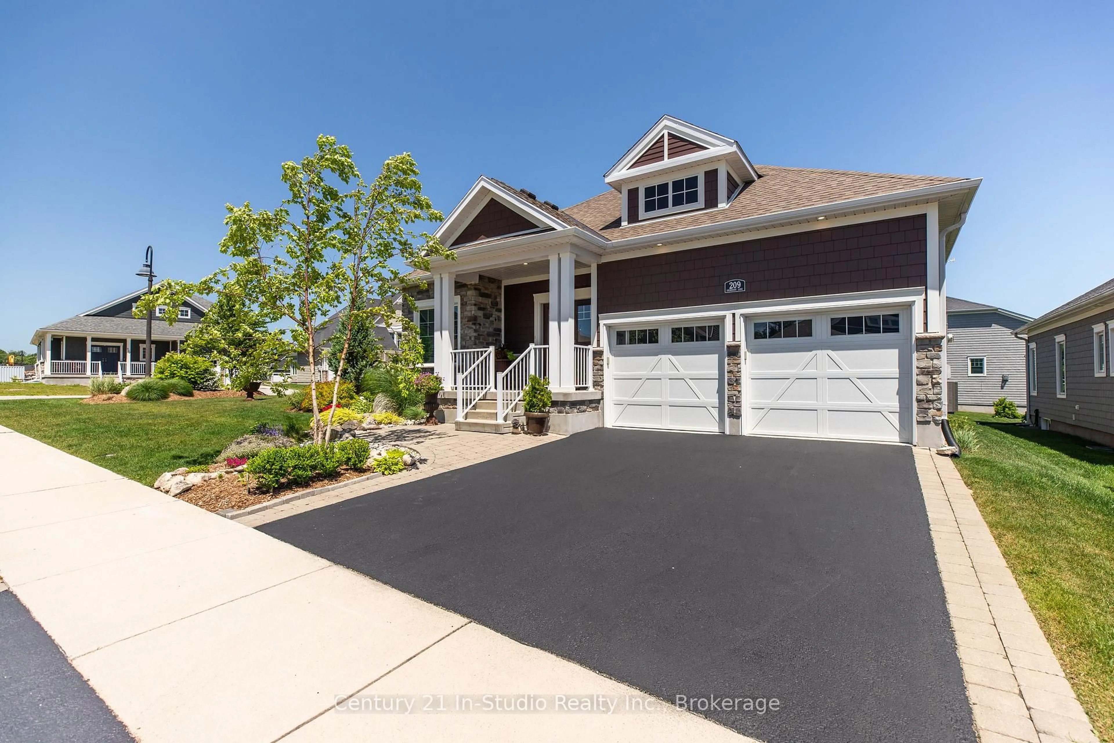Home with vinyl exterior material, street for 209 Snowberry Lane, Georgian Bluffs Ontario N0H 1S0
