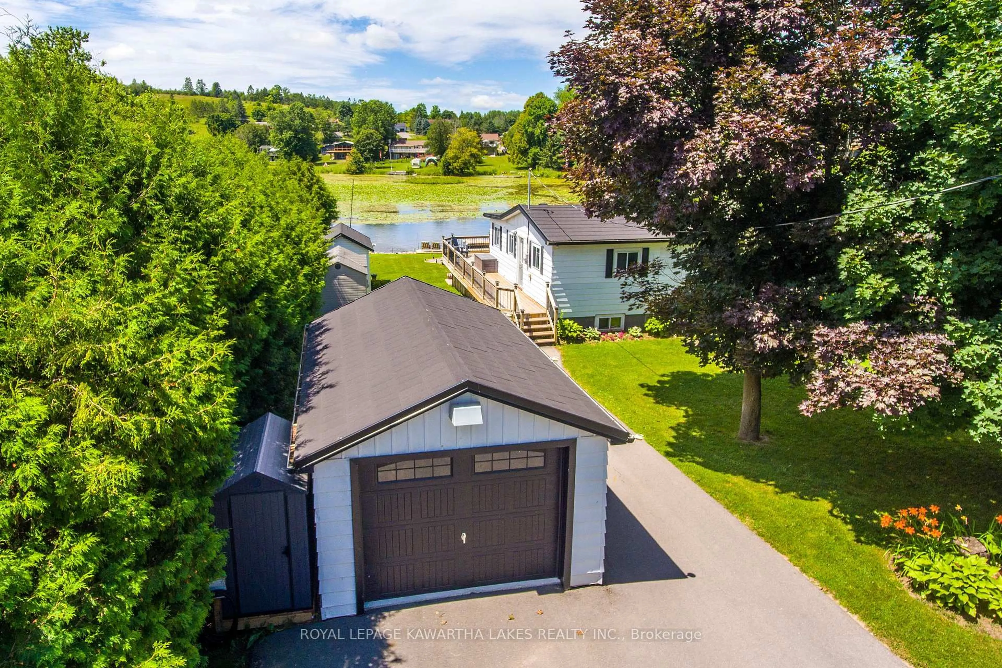 A pic from outside/outdoor area/front of a property/back of a property/a pic from drone, water/lake/river/ocean view for 28 Cadillac Blvd, Kawartha Lakes Ontario K0L 2W0