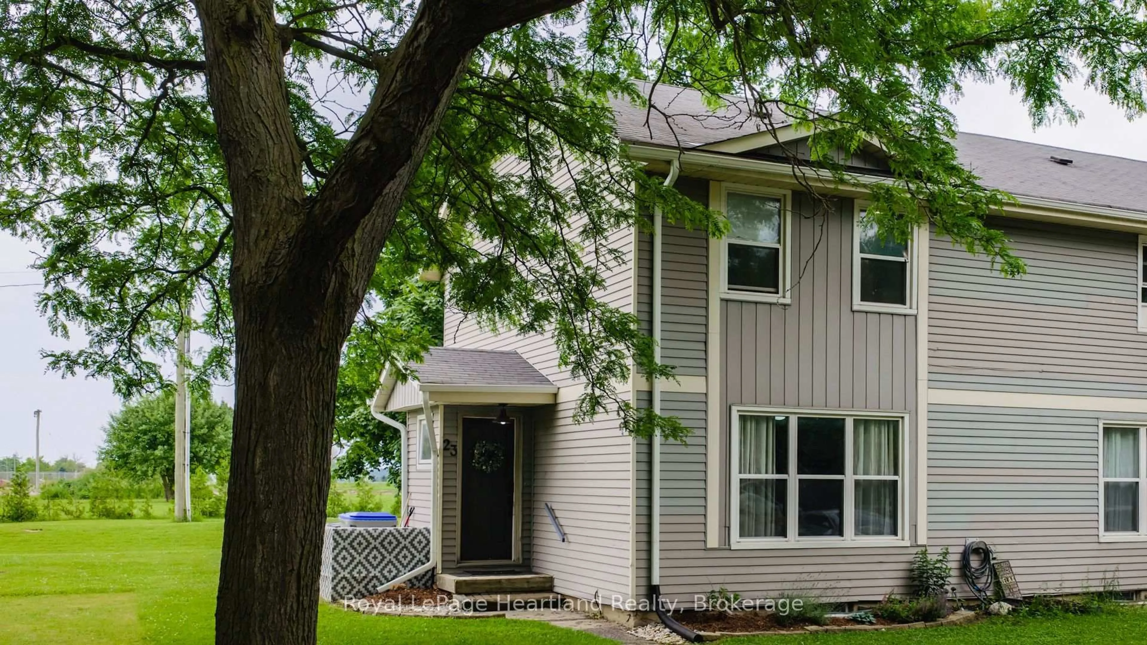 Home with vinyl exterior material, street for 23 St Charles Sq #23, Huron East Ontario N0M 1L0