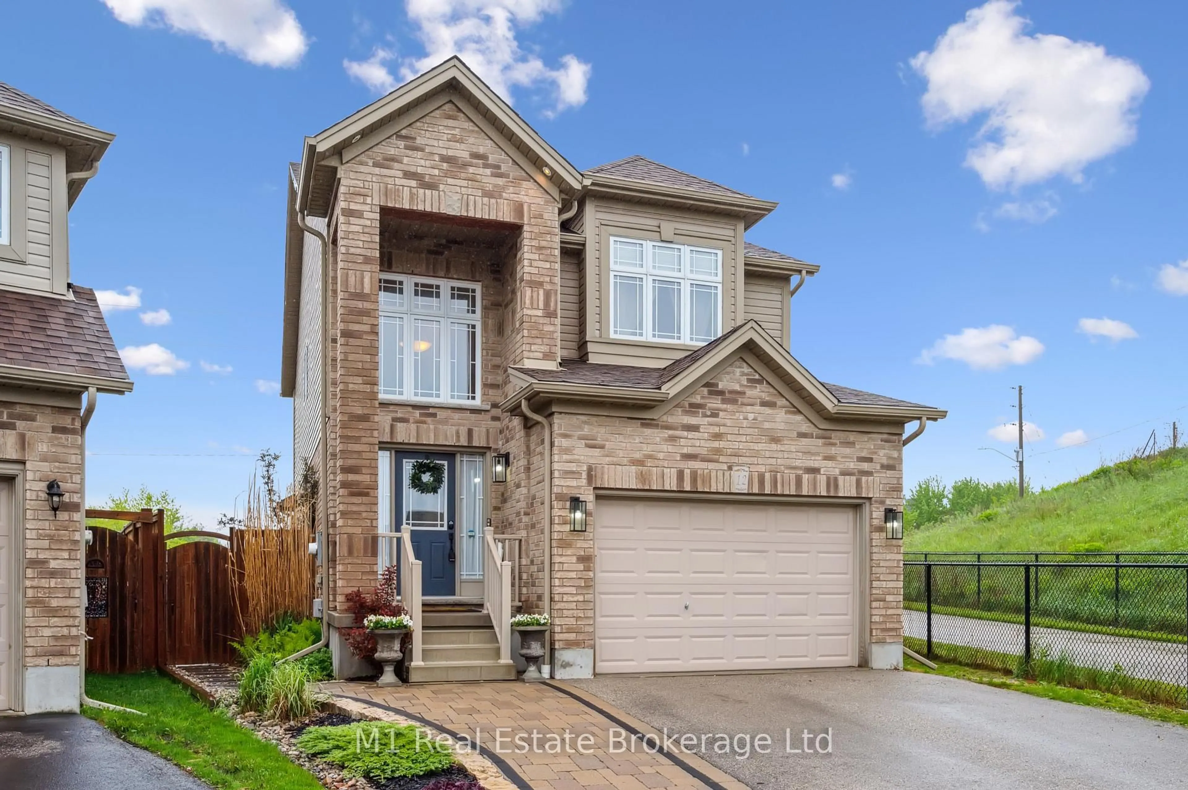 Home with brick exterior material, street for 12 Oakes Crt, Guelph Ontario N1E 0J6