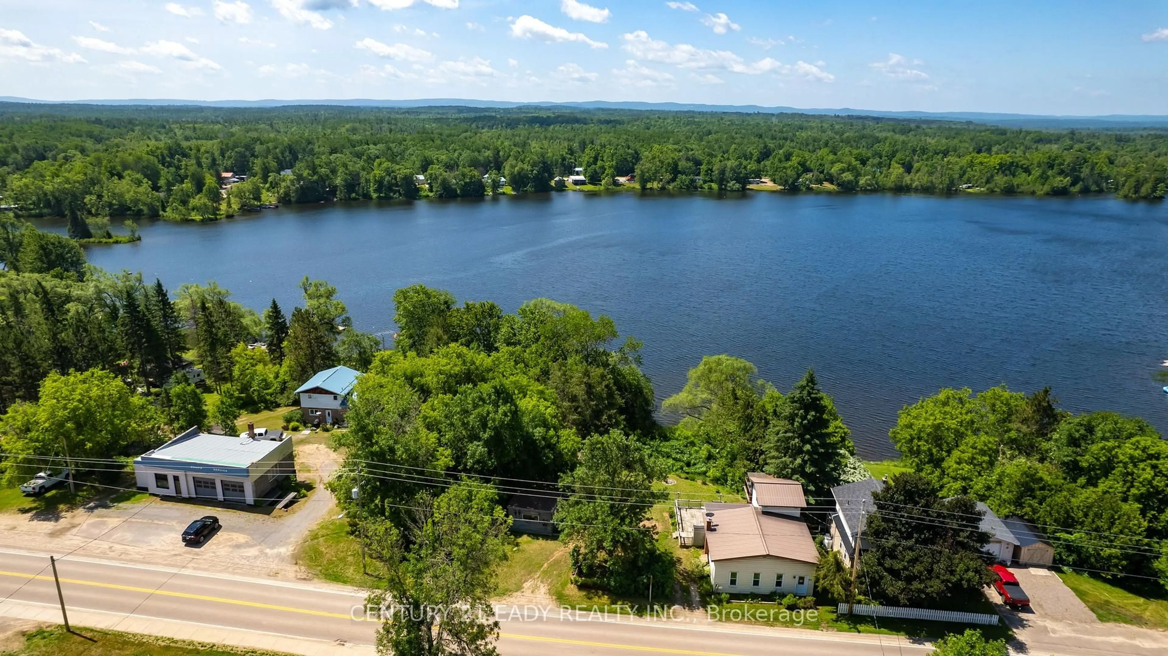 A pic from outside/outdoor area/front of a property/back of a property/a pic from drone, water/lake/river/ocean view for 11147 60 Highway, Golden Lake Ontario K0J 1X0