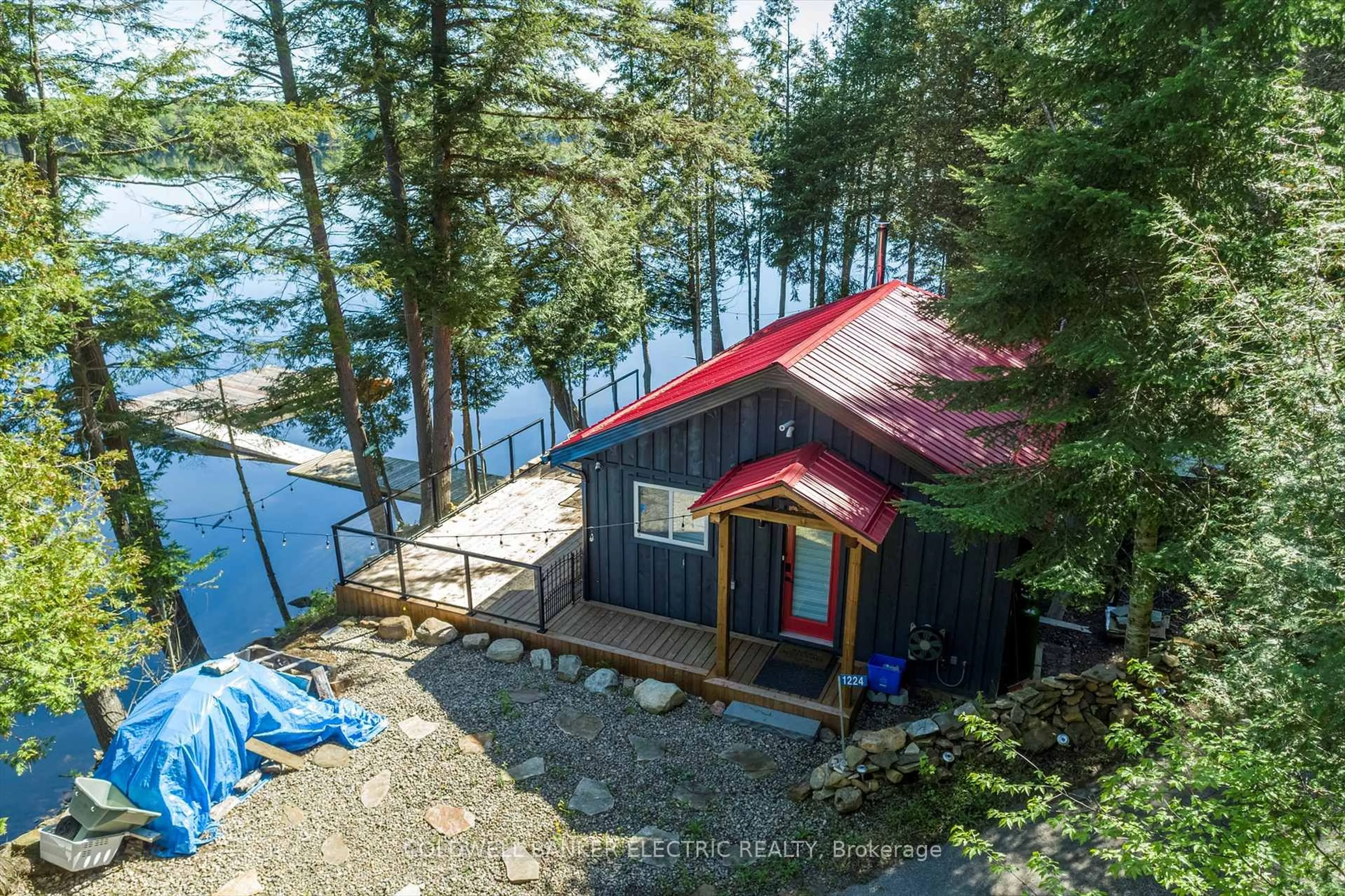 A pic from outside/outdoor area/front of a property/back of a property/a pic from drone, water/lake/river/ocean view for 1224 McCrackens Lane, Minden Hills Ontario K0M 2K0