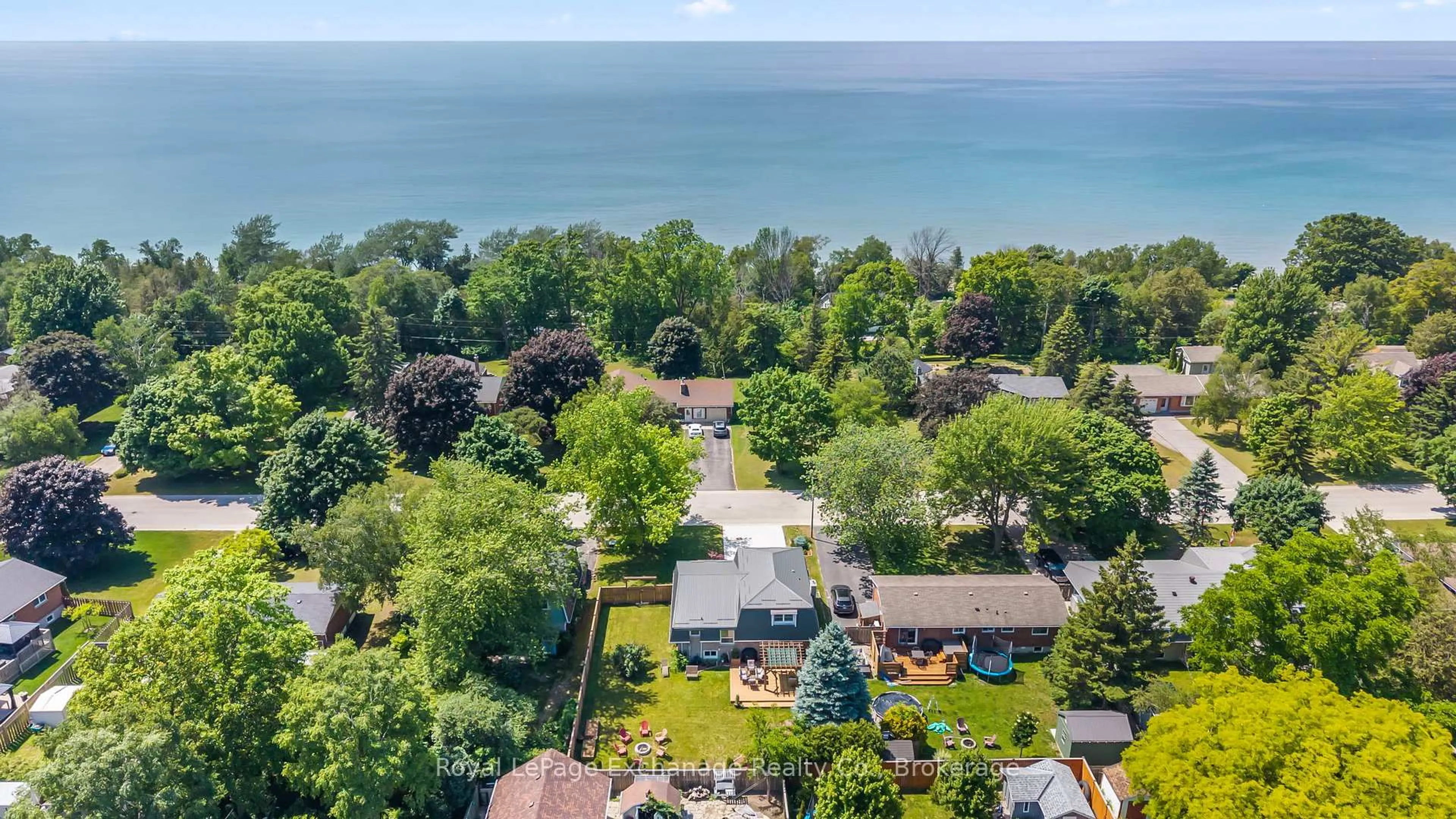A pic from outside/outdoor area/front of a property/back of a property/a pic from drone, water/lake/river/ocean view for 21 Penetangore Row, Huron-Kinloss Ontario N2Z 2M3