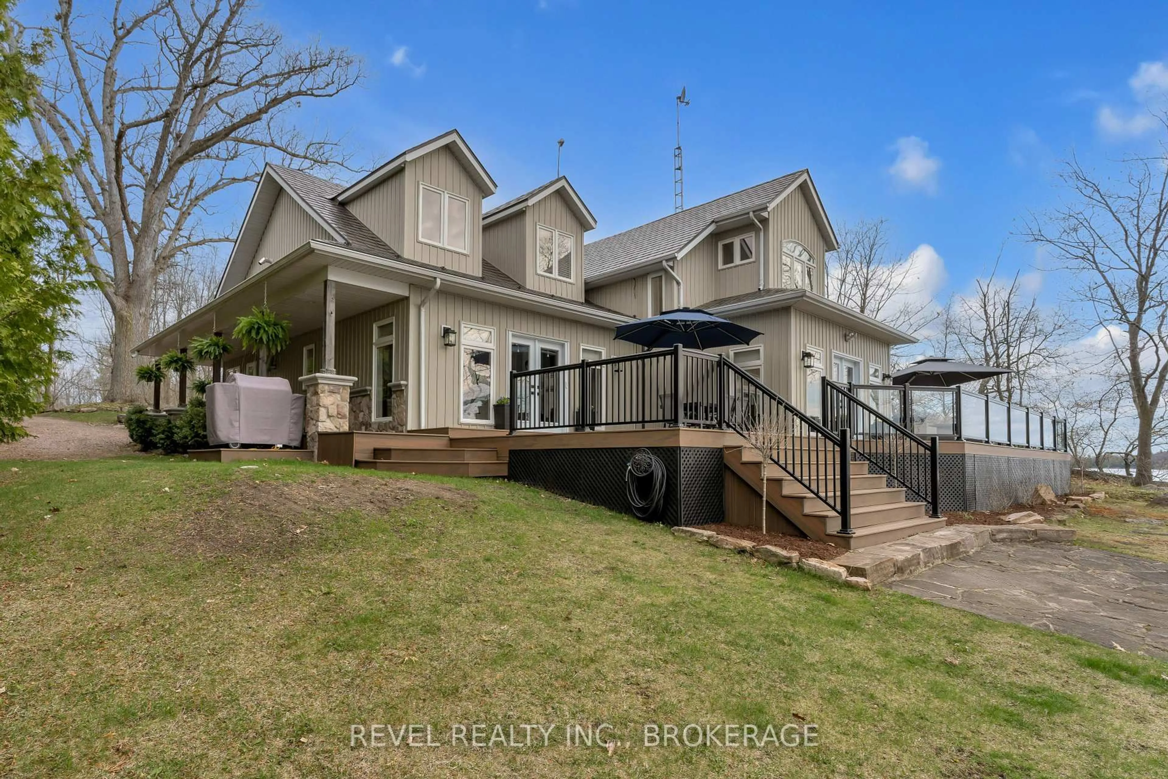A pic from outside/outdoor area/front of a property/back of a property/a pic from drone, water/lake/river/ocean view for 4078 Hideaway Lane, Battersea Ontario K0H 1H0