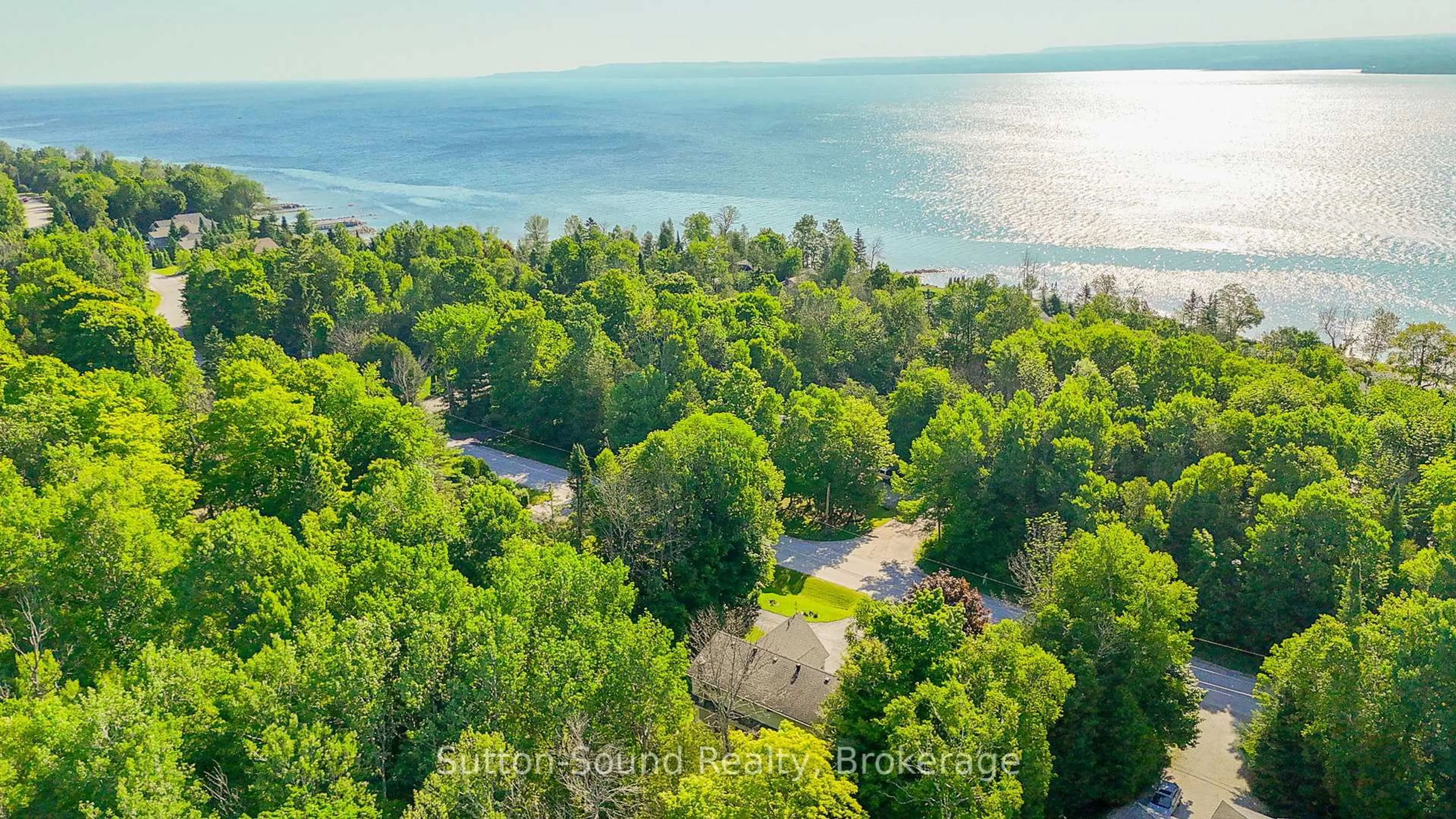A pic from outside/outdoor area/front of a property/back of a property/a pic from drone, water/lake/river/ocean view for 168 Balmy Beach Rd, Georgian Bluffs Ontario N4K 5N4