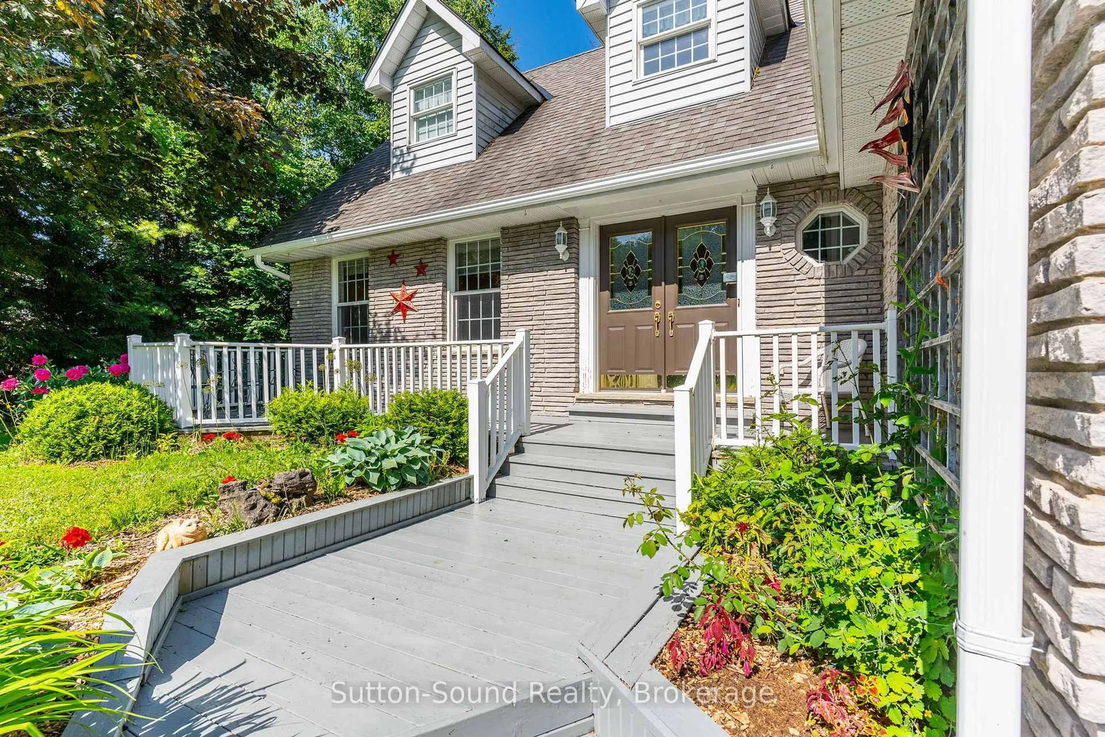 Home with brick exterior material, street for 168 Balmy Beach Rd, Georgian Bluffs Ontario N4K 5N4
