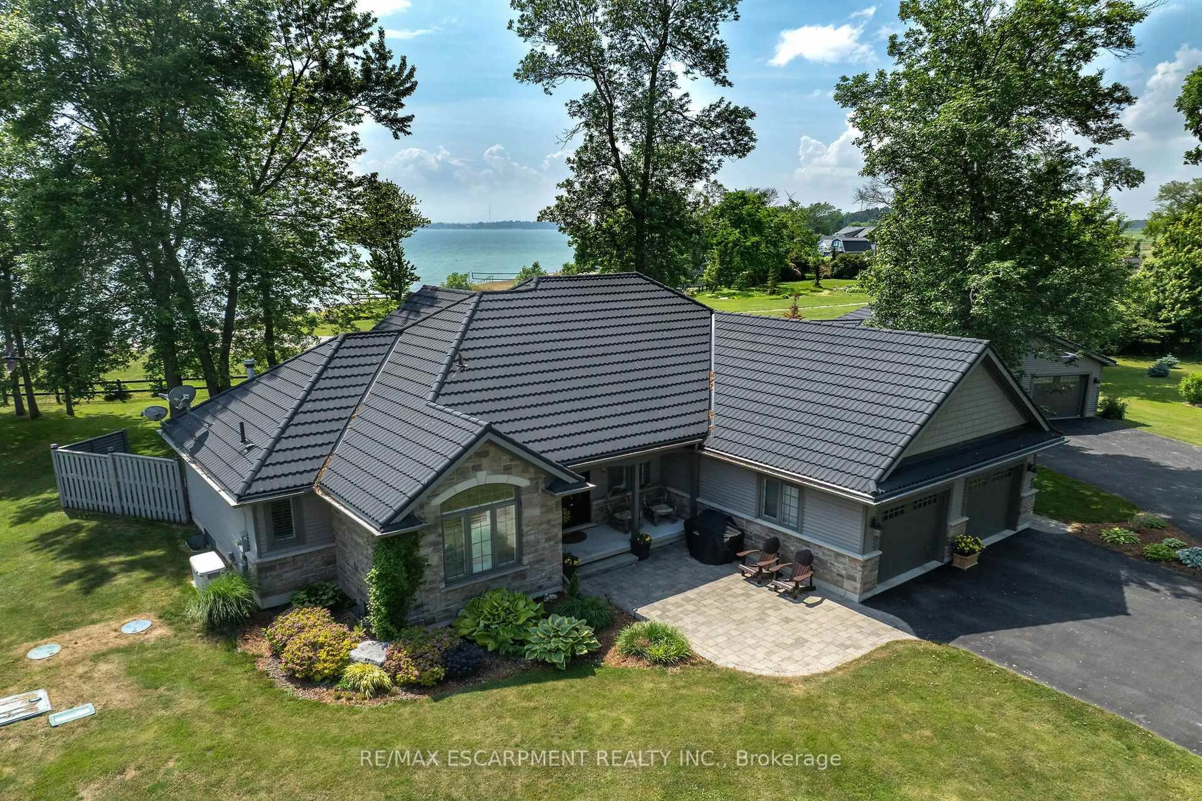 A pic from outside/outdoor area/front of a property/back of a property/a pic from drone, water/lake/river/ocean view for 17 BATES Lane, Haldimand Ontario N1A 2W8