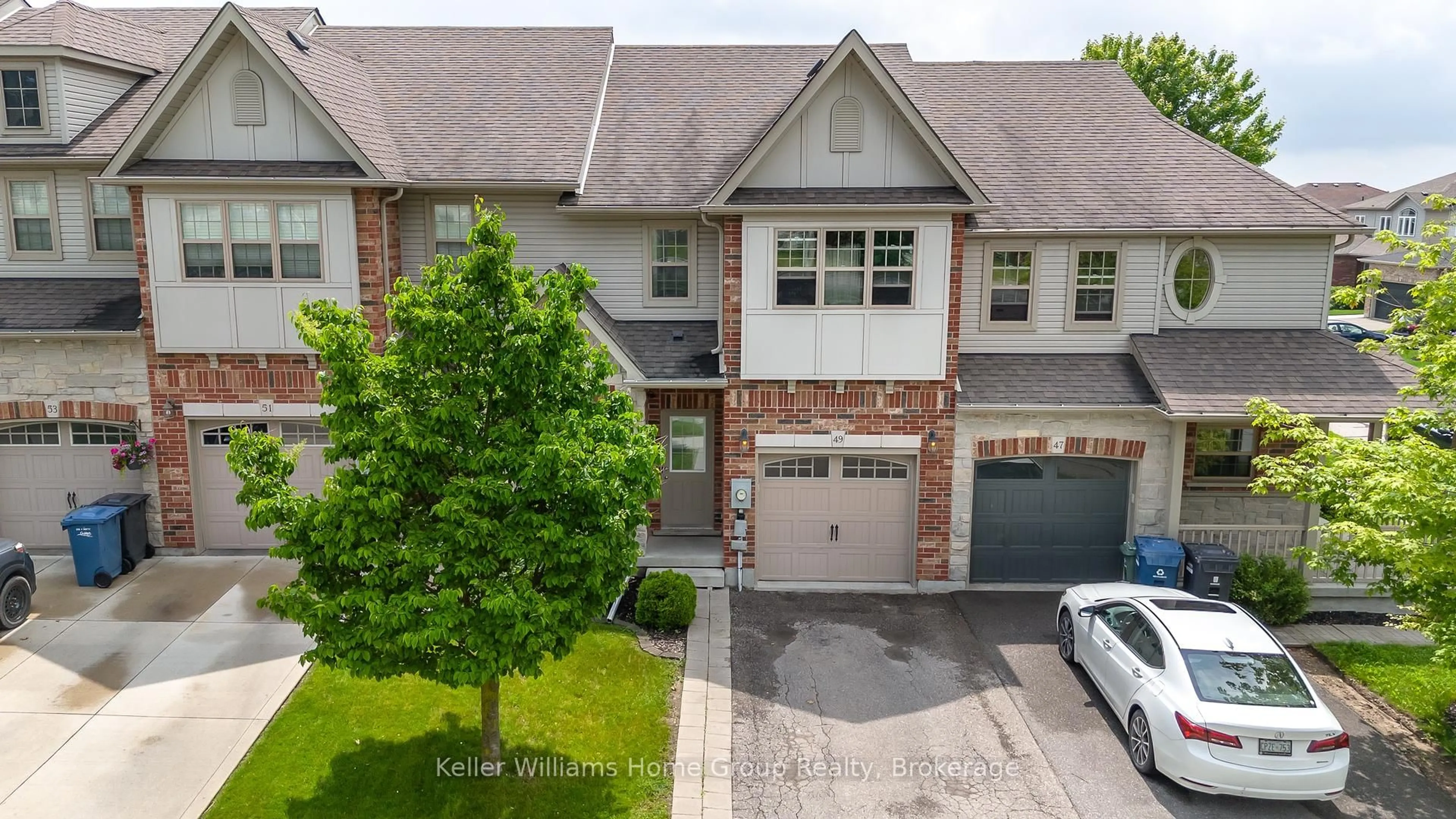 A pic from outside/outdoor area/front of a property/back of a property/a pic from drone, street for 49 WASHBURN Dr, Guelph Ontario N1E 0B2