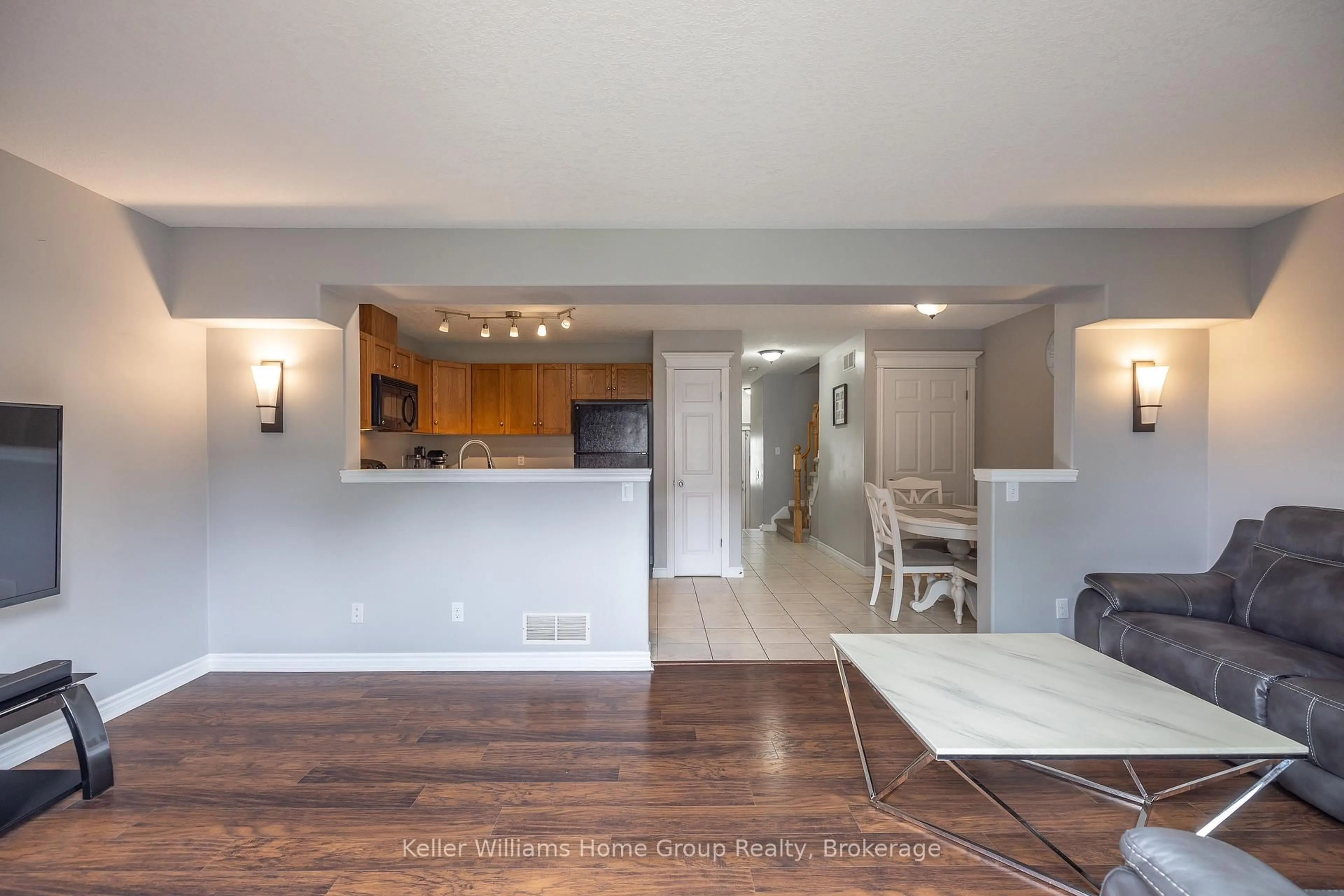 Open concept kitchen, wood/laminate floor for 49 WASHBURN Dr, Guelph Ontario N1E 0B2