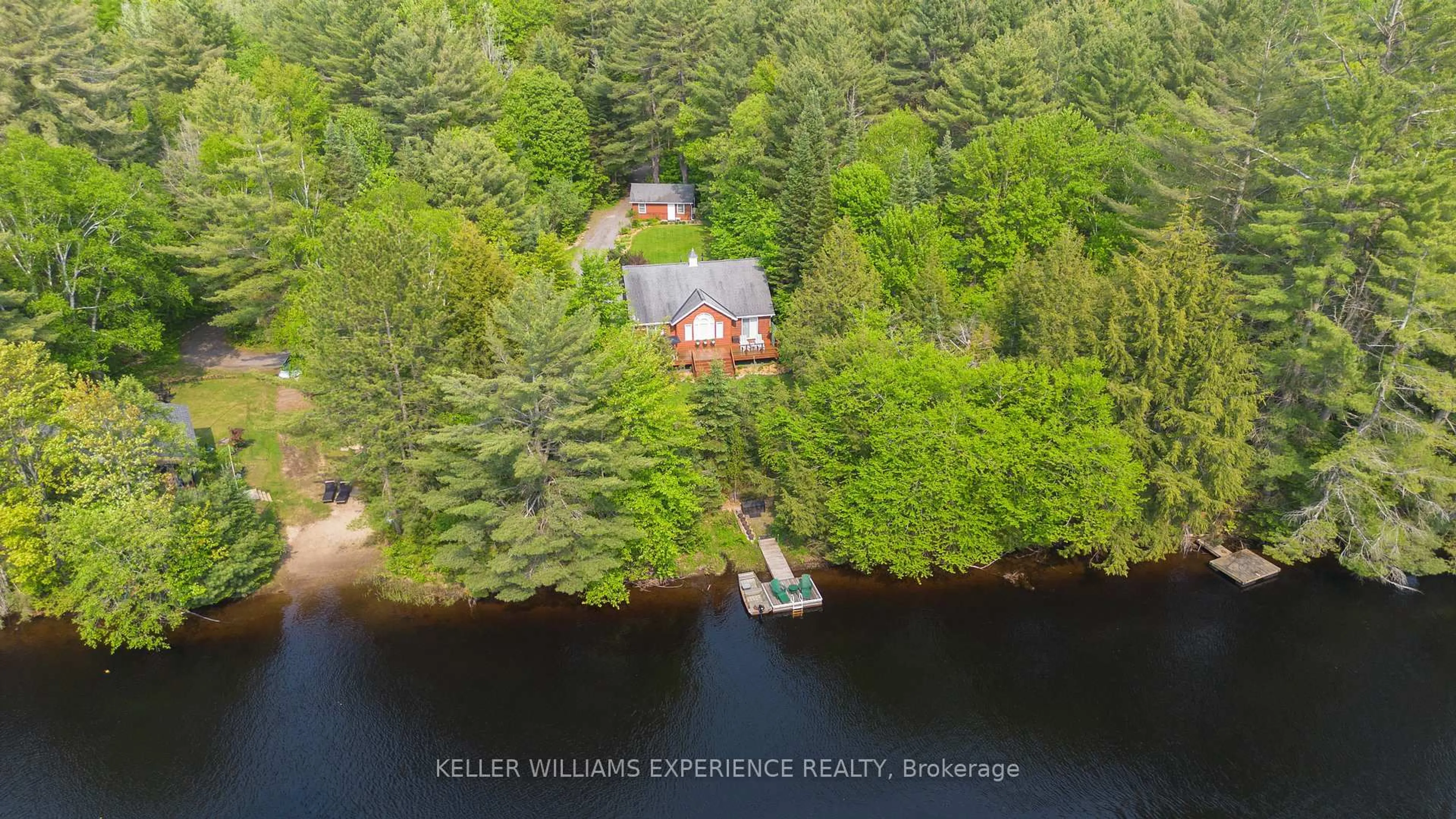 A pic from outside/outdoor area/front of a property/back of a property/a pic from drone, water/lake/river/ocean view for 1065 Forrester Tr, Bracebridge Ontario P1L 1W9