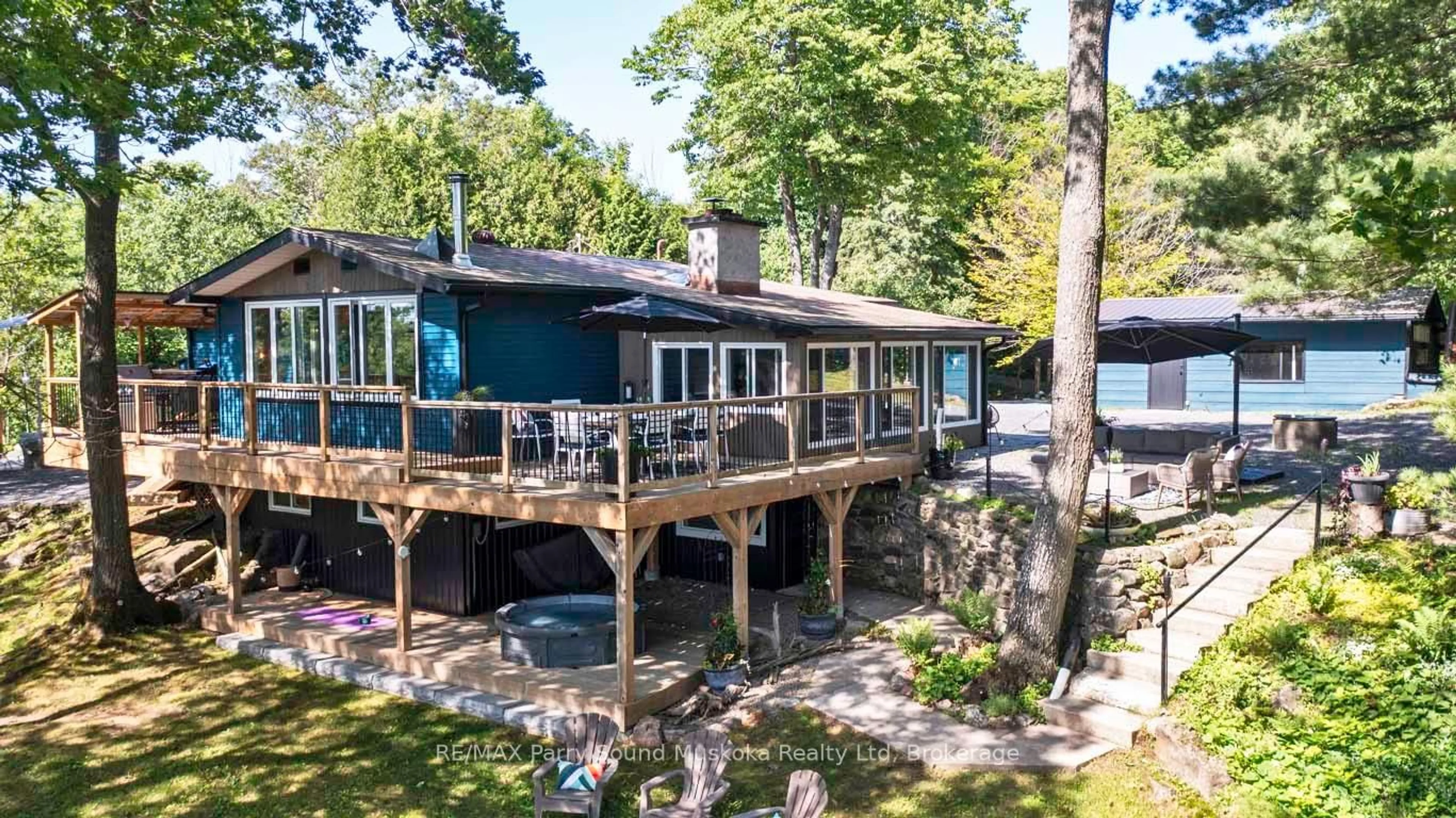 A pic from outside/outdoor area/front of a property/back of a property/a pic from drone, water/lake/river/ocean view for 16 Birch Cres, Seguin Ontario P2A 0B2