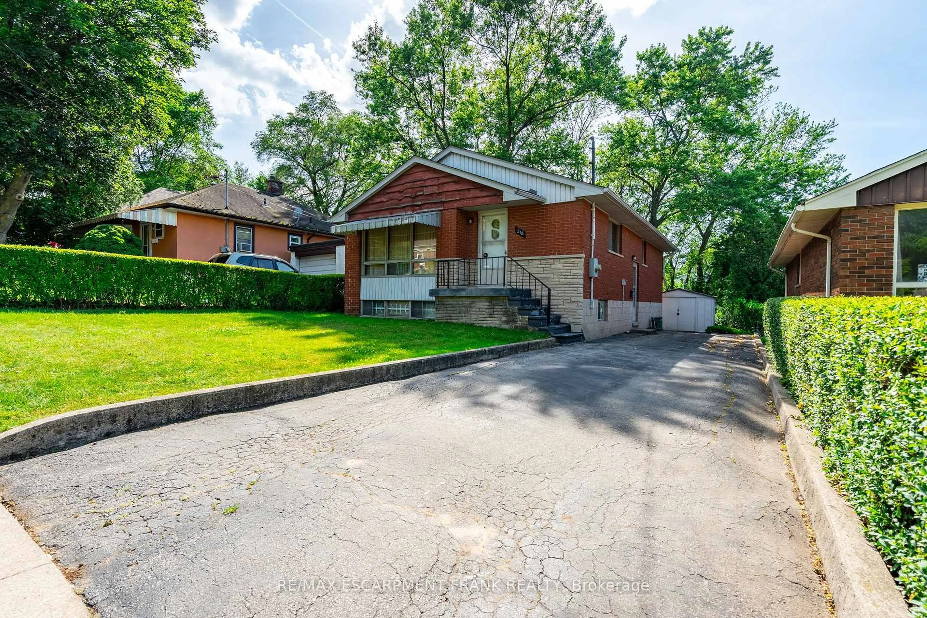 Home with brick exterior material, street for 218 BOWMAN St, Hamilton Ontario L8S 2V1