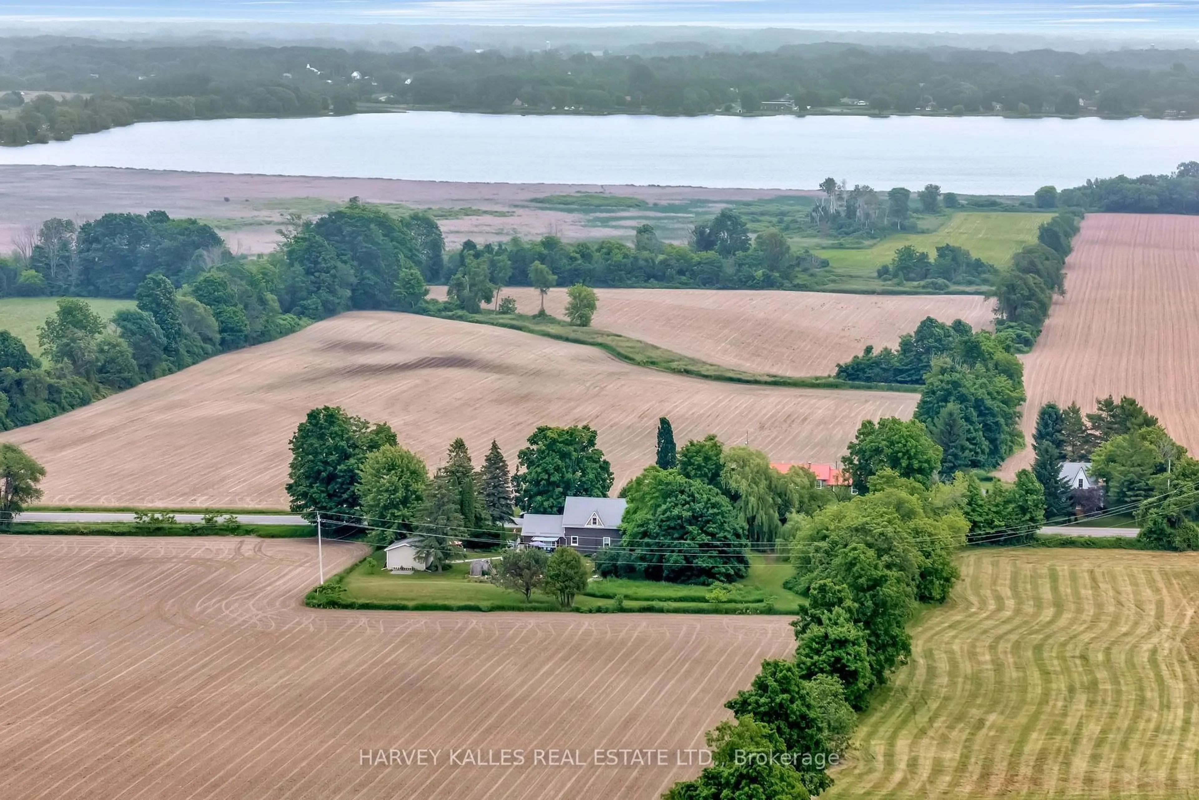 A pic from outside/outdoor area/front of a property/back of a property/a pic from drone, water/lake/river/ocean view for 286 County Rd 11 Rd, Prince Edward County Ontario K0K 2T0