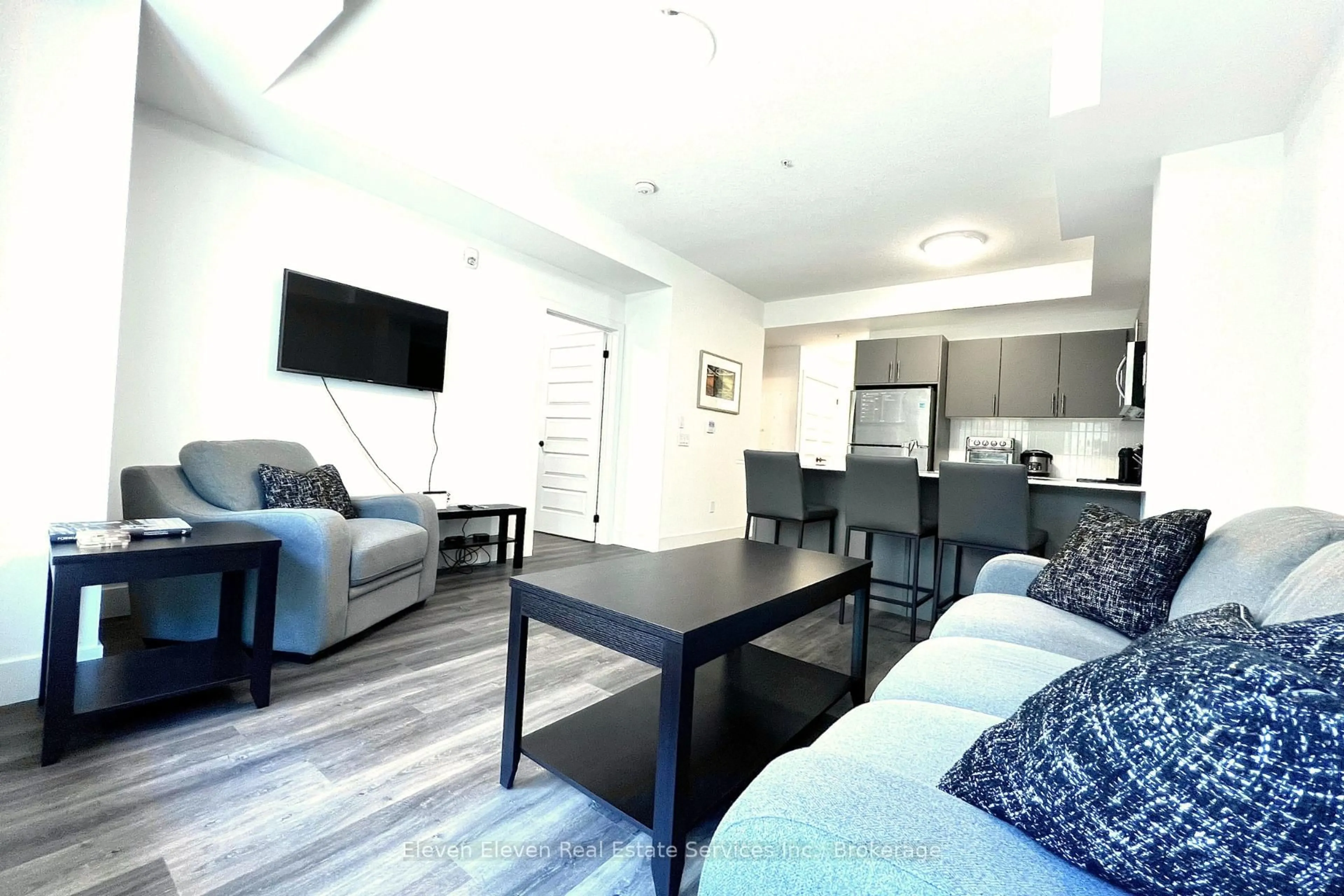 Living room with furniture, wood/laminate floor for 1201 Lackner Blvd #407, Kitchener Ontario N2A 0L4