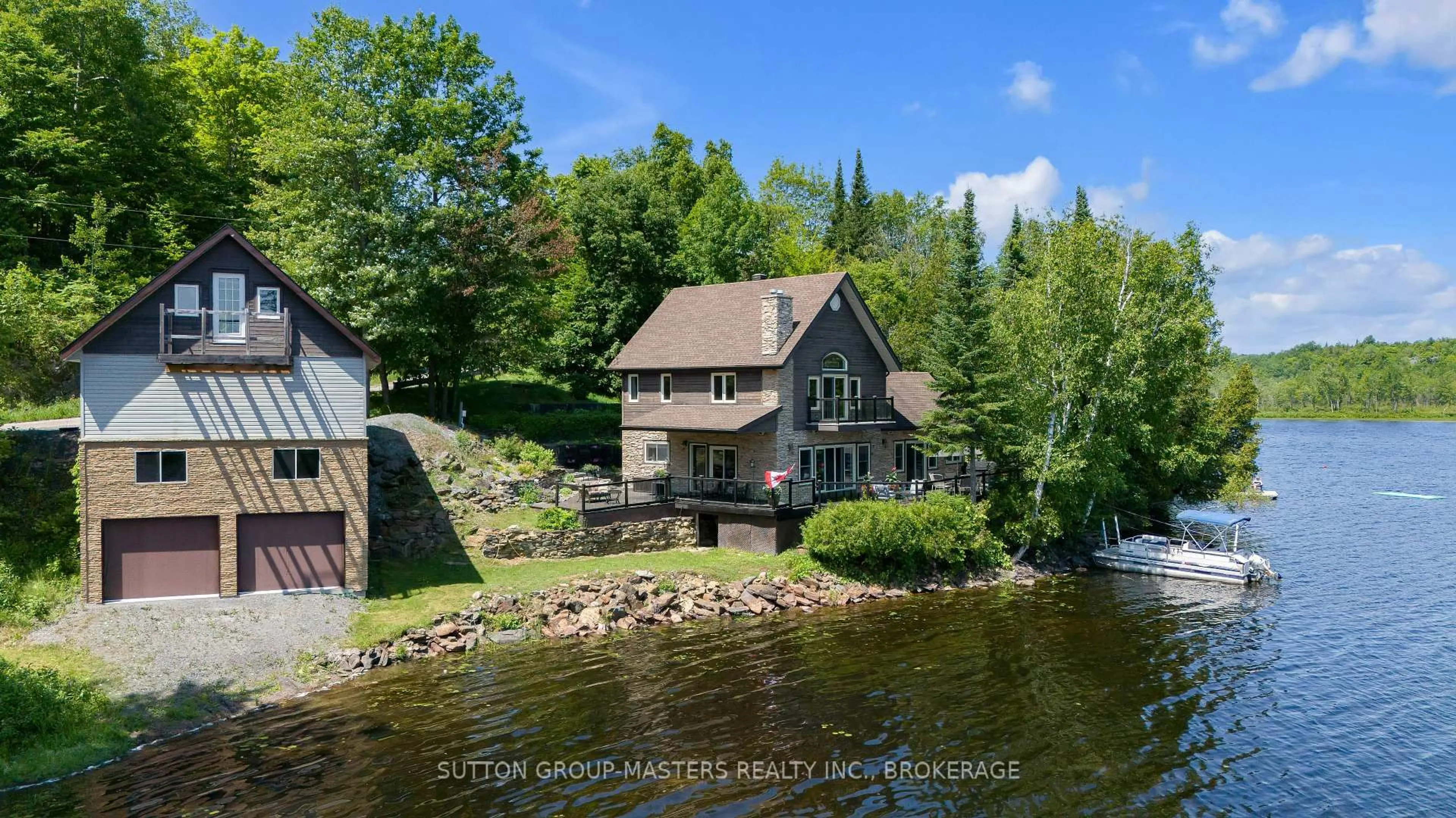 A pic from outside/outdoor area/front of a property/back of a property/a pic from drone, water/lake/river/ocean view for 2000 Brewer Rd, Sharbot Lake Ontario K0H 2P0