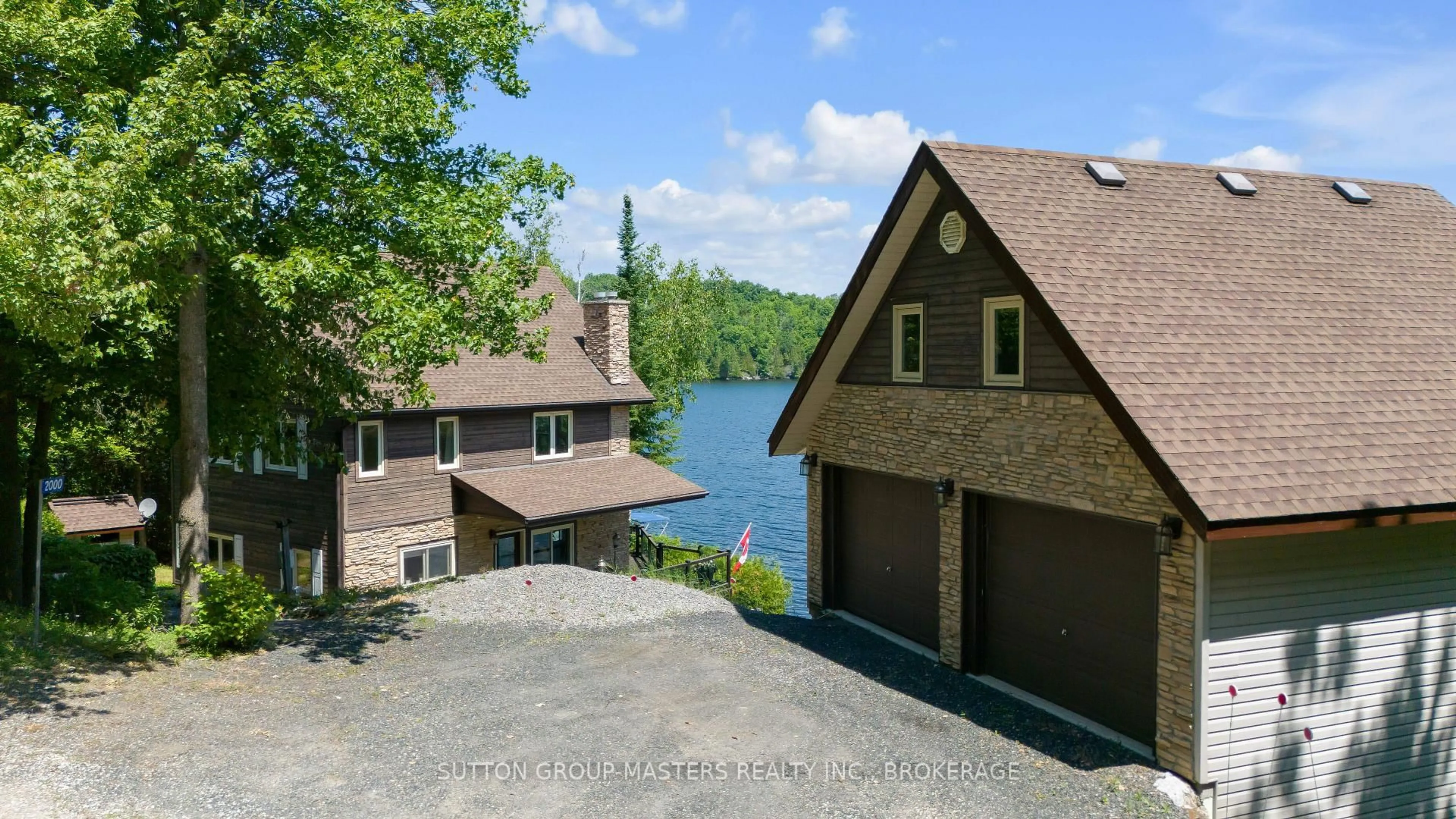 A pic from outside/outdoor area/front of a property/back of a property/a pic from drone, water/lake/river/ocean view for 2000 Brewer Rd, Sharbot Lake Ontario K0H 2P0