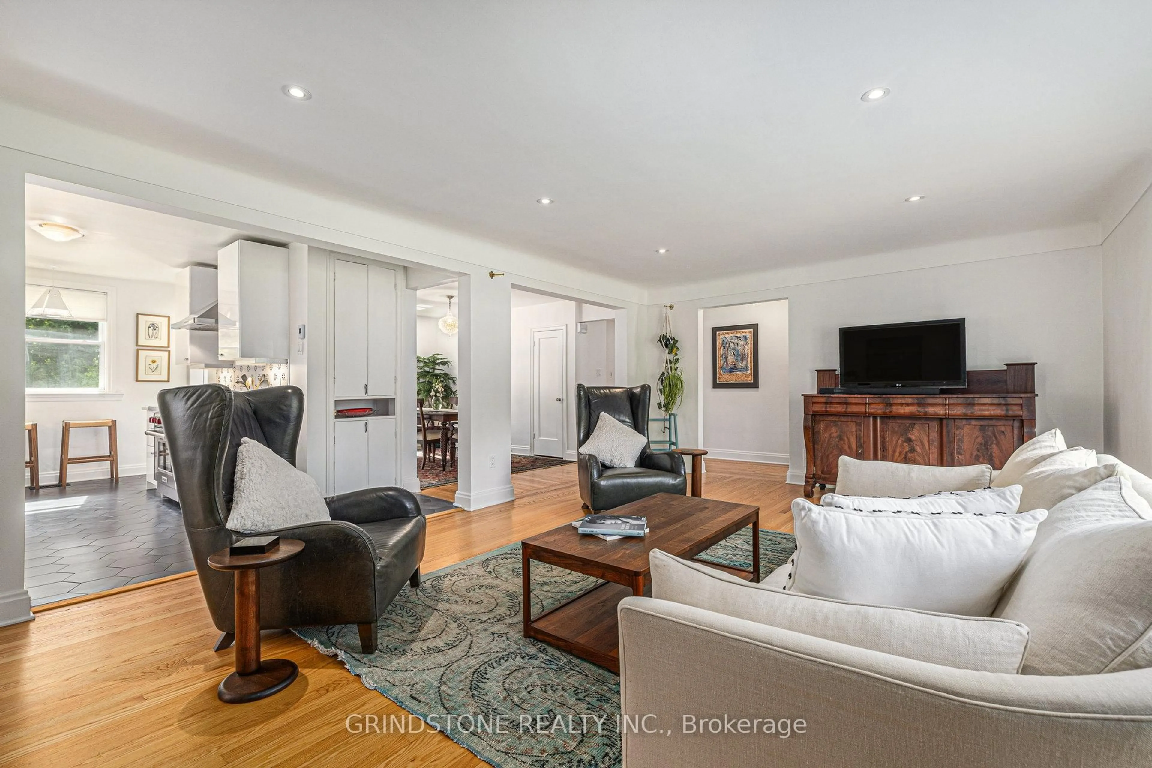 Living room with furniture, wood/laminate floor for 824 Melwood Ave, Ottawa Ontario K2A 3C3