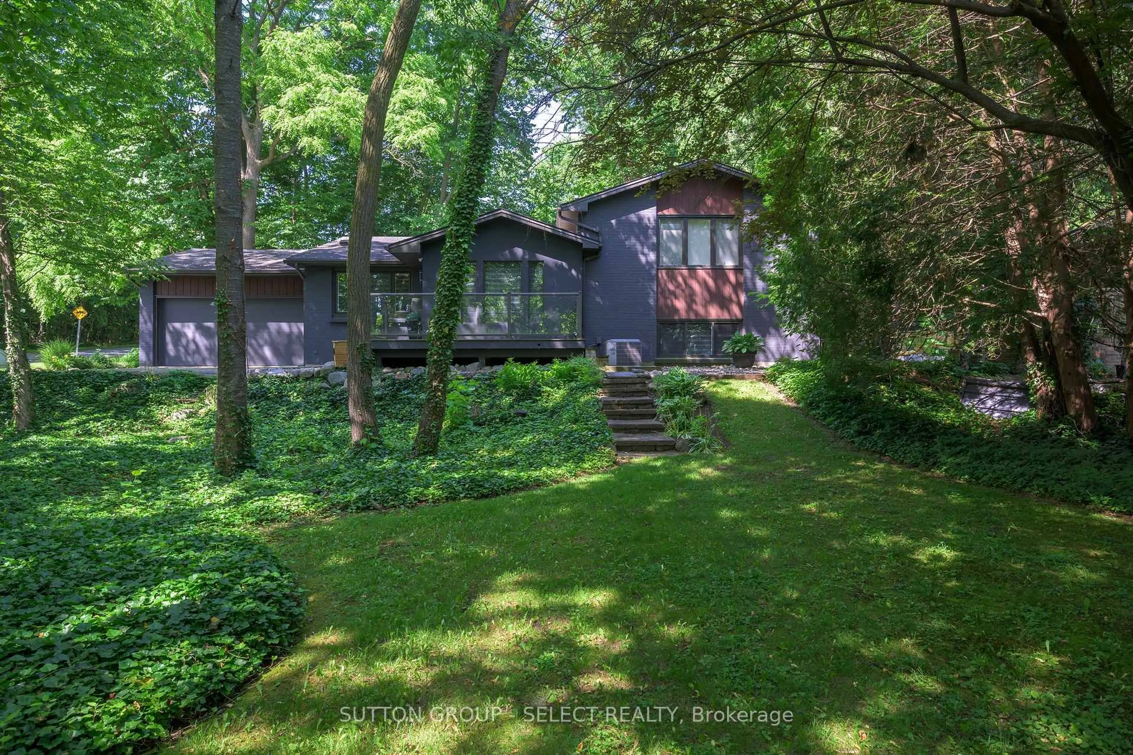 A pic from outside/outdoor area/front of a property/back of a property/a pic from drone, forest/trees view for 1625 Hillside Dr, London North Ontario N6G 2R1