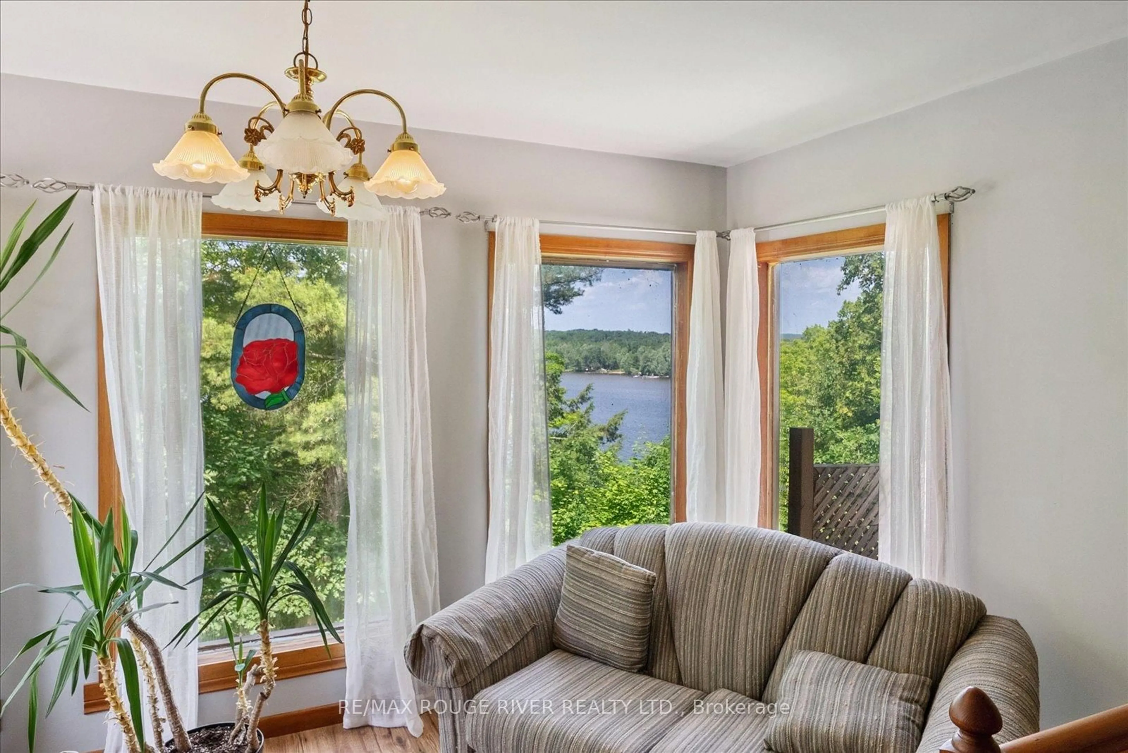 Living room with furniture, wood/laminate floor for 739 Marble Point Rd, Limoges Ontario K0K 2M0