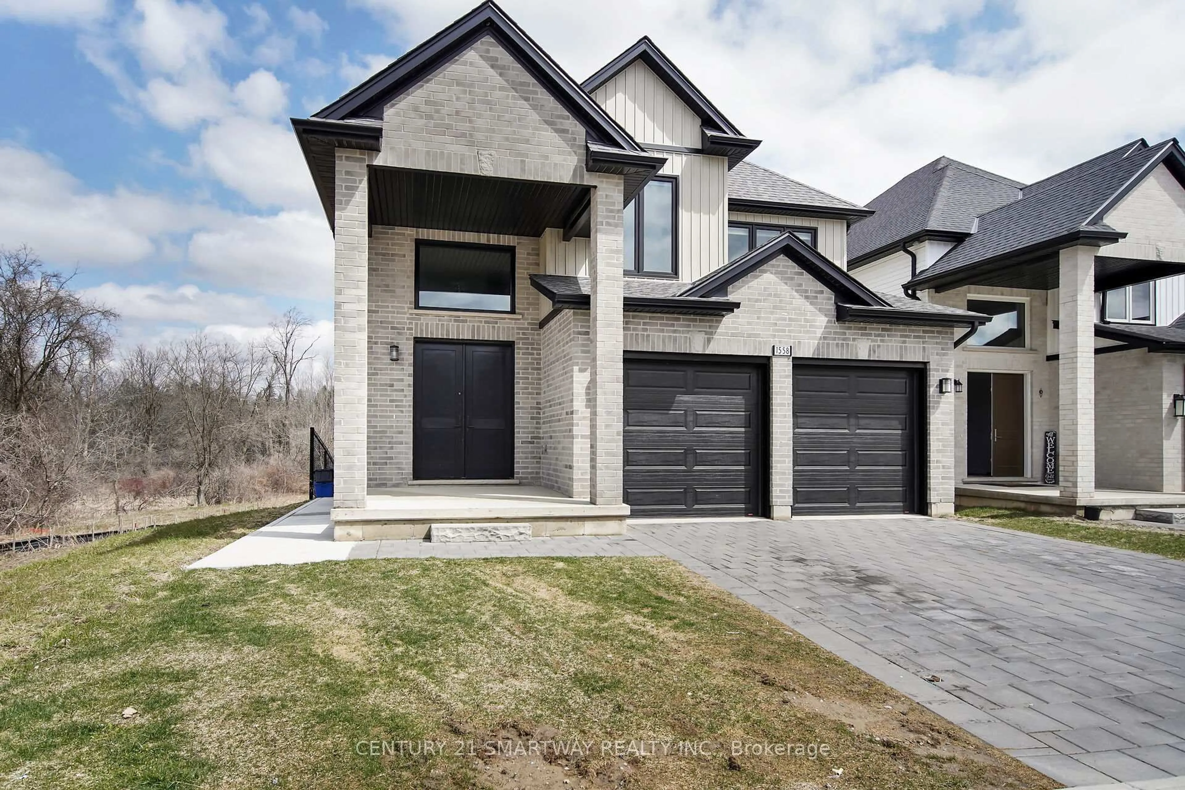 Home with brick exterior material, street for 1558 Chickadee Tr, London South Ontario N6M 0K1