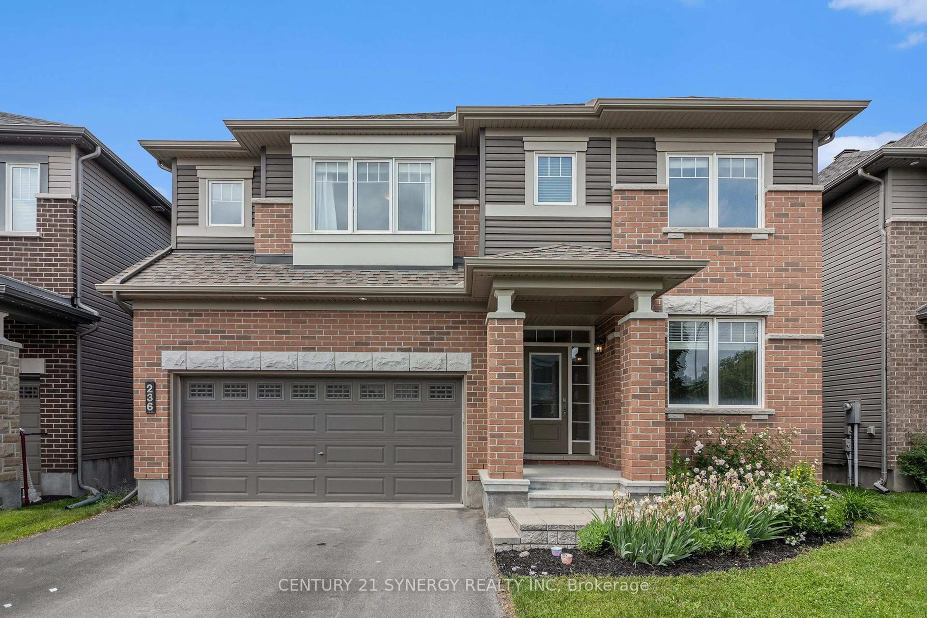 Home with brick exterior material, street for 236 Enclave Walk, Ottawa Ontario K1W 0J4