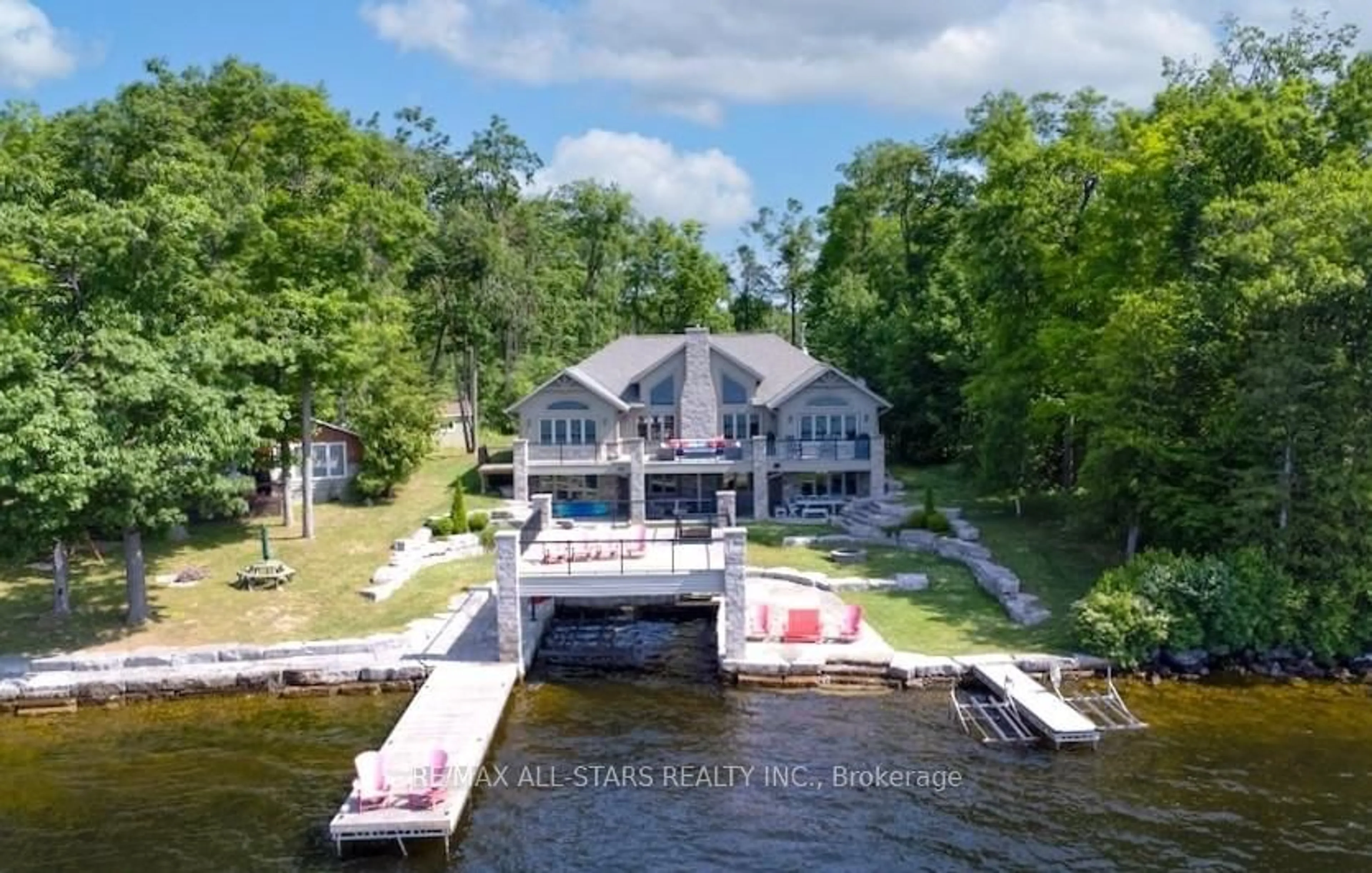 A pic from outside/outdoor area/front of a property/back of a property/a pic from drone, water/lake/river/ocean view for 64 Fire Route 103 B, Trent Lakes Ontario K0M 1A0