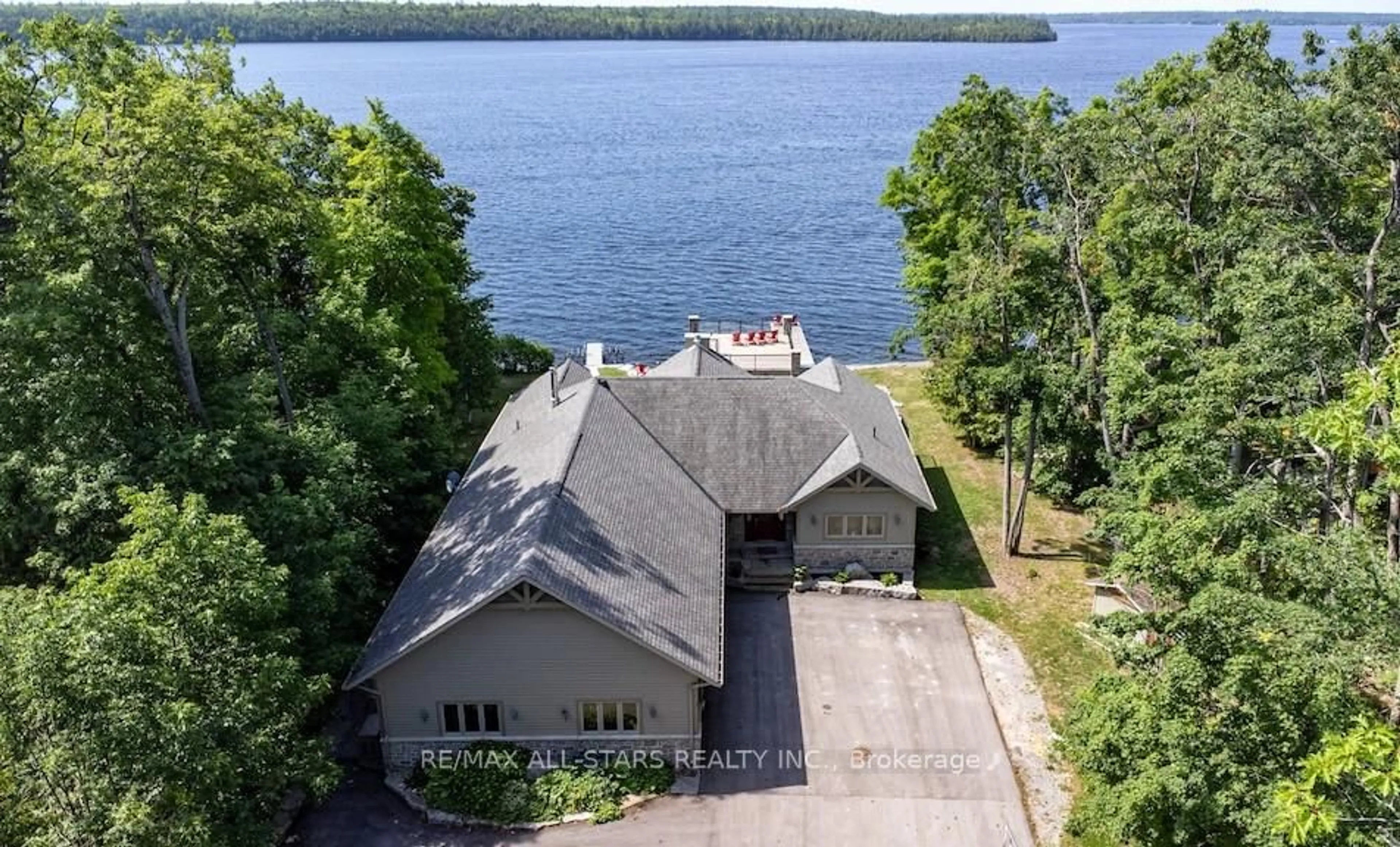 A pic from outside/outdoor area/front of a property/back of a property/a pic from drone, water/lake/river/ocean view for 64 Fire Route 103 B, Trent Lakes Ontario K0M 1A0