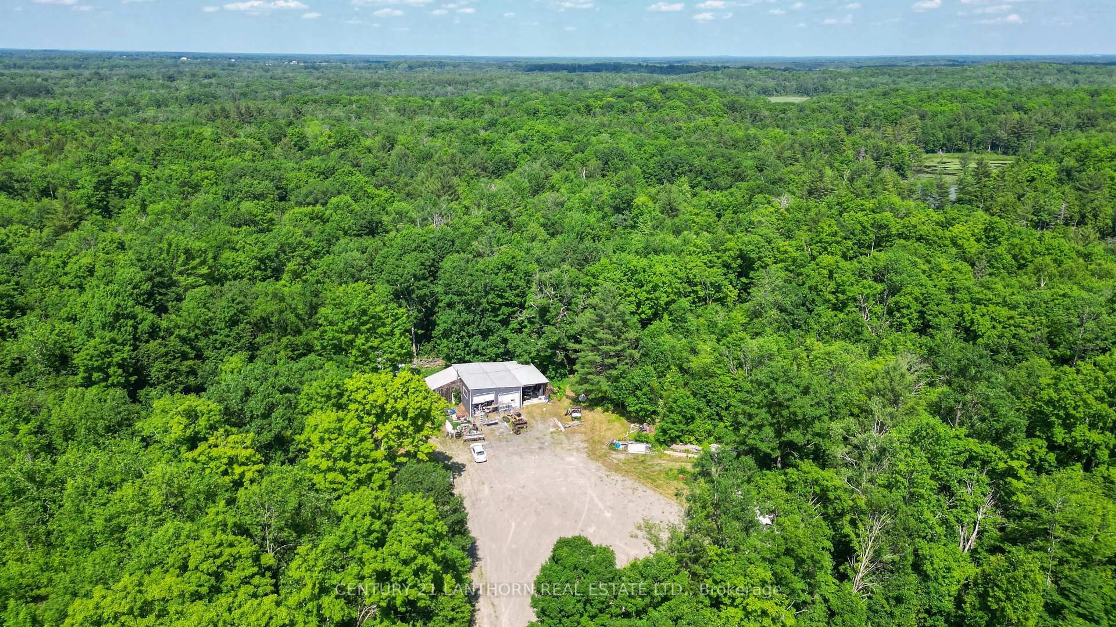 A pic from outside/outdoor area/front of a property/back of a property/a pic from drone, forest/trees view for 932 Hunt Club Rd, Madoc Ontario K0K 2K0
