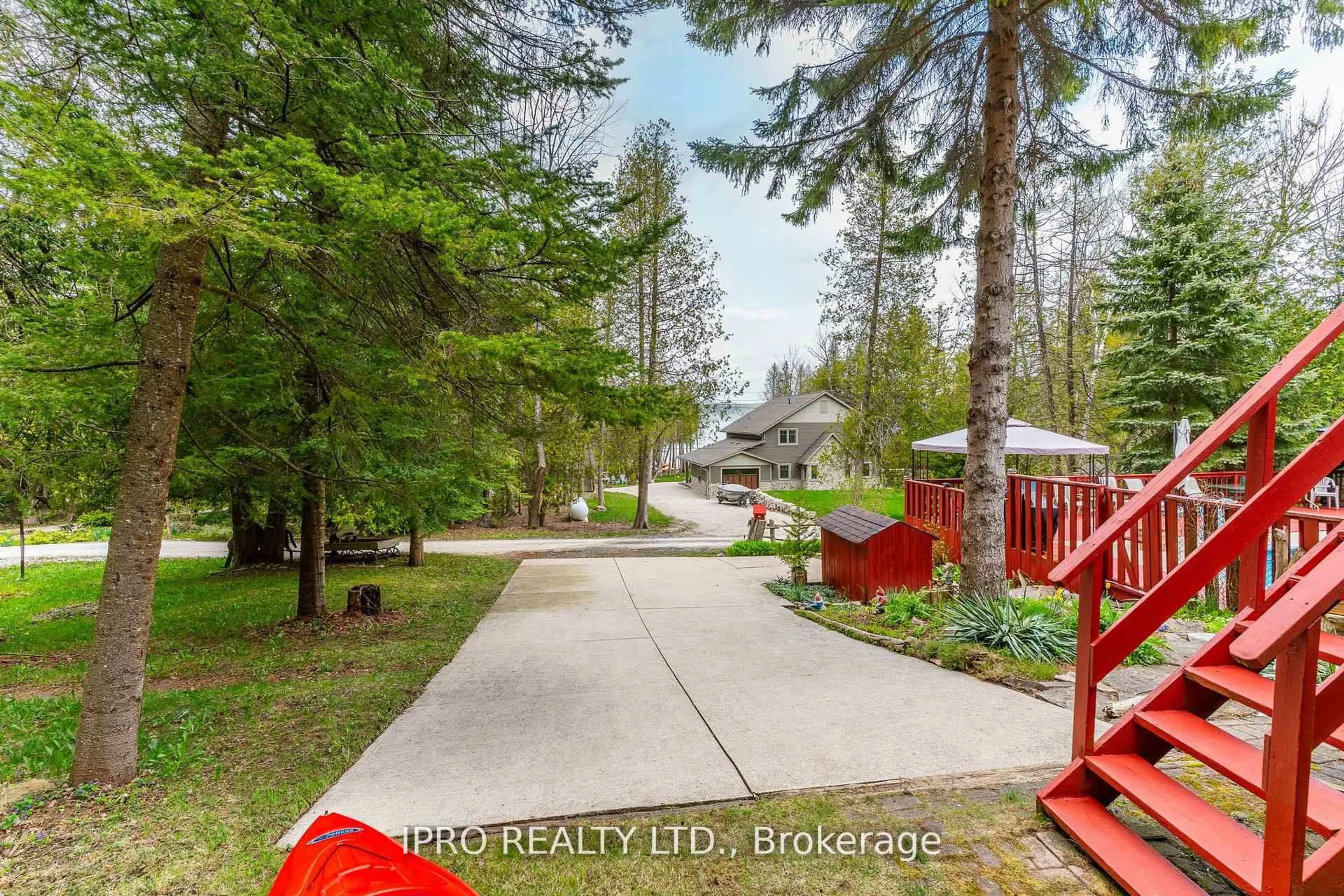 A pic from outside/outdoor area/front of a property/back of a property/a pic from drone, forest/trees view for 502495 Grey Road 1, Georgian Bluffs Ontario N0H 2T0