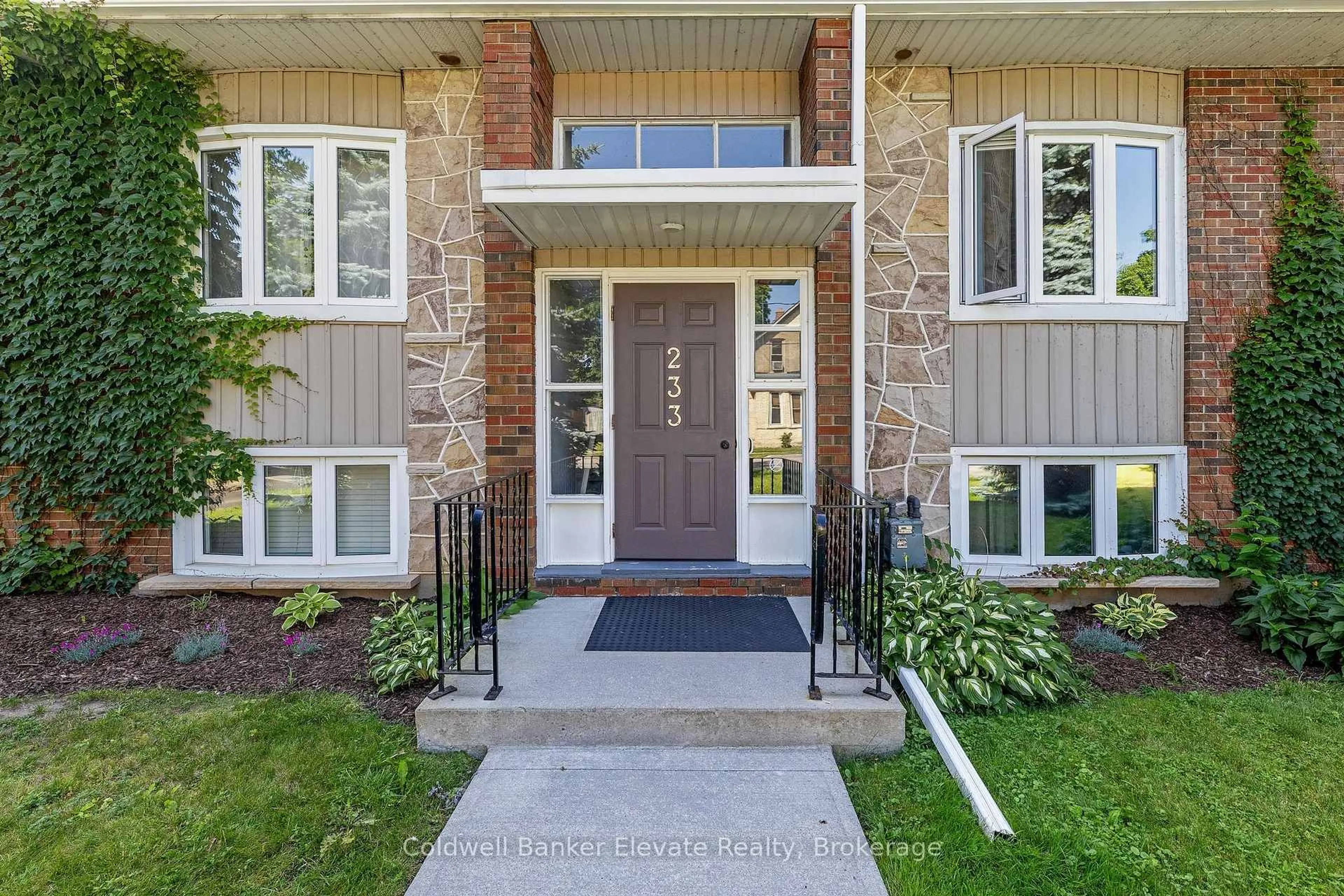 Home with brick exterior material, street for 233 Westminster Dr #24, Cambridge Ontario N3H 1T2