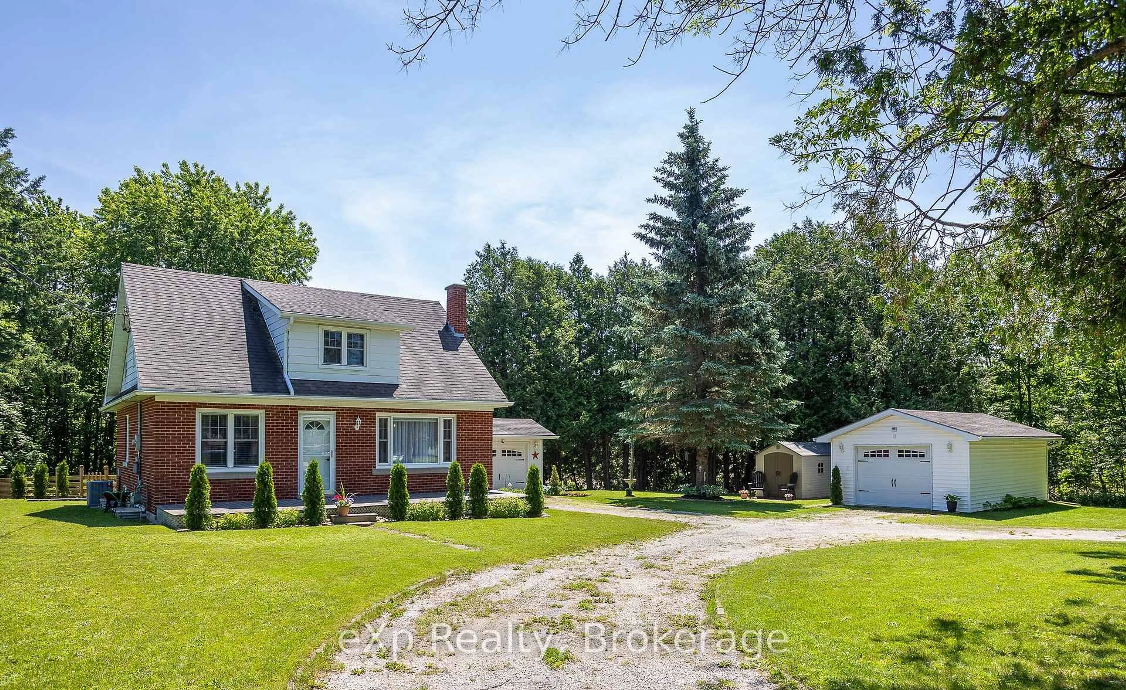 A pic from outside/outdoor area/front of a property/back of a property/a pic from drone, street for 318827 Grey Road 1, Georgian Bluffs Ontario N4K 5N4