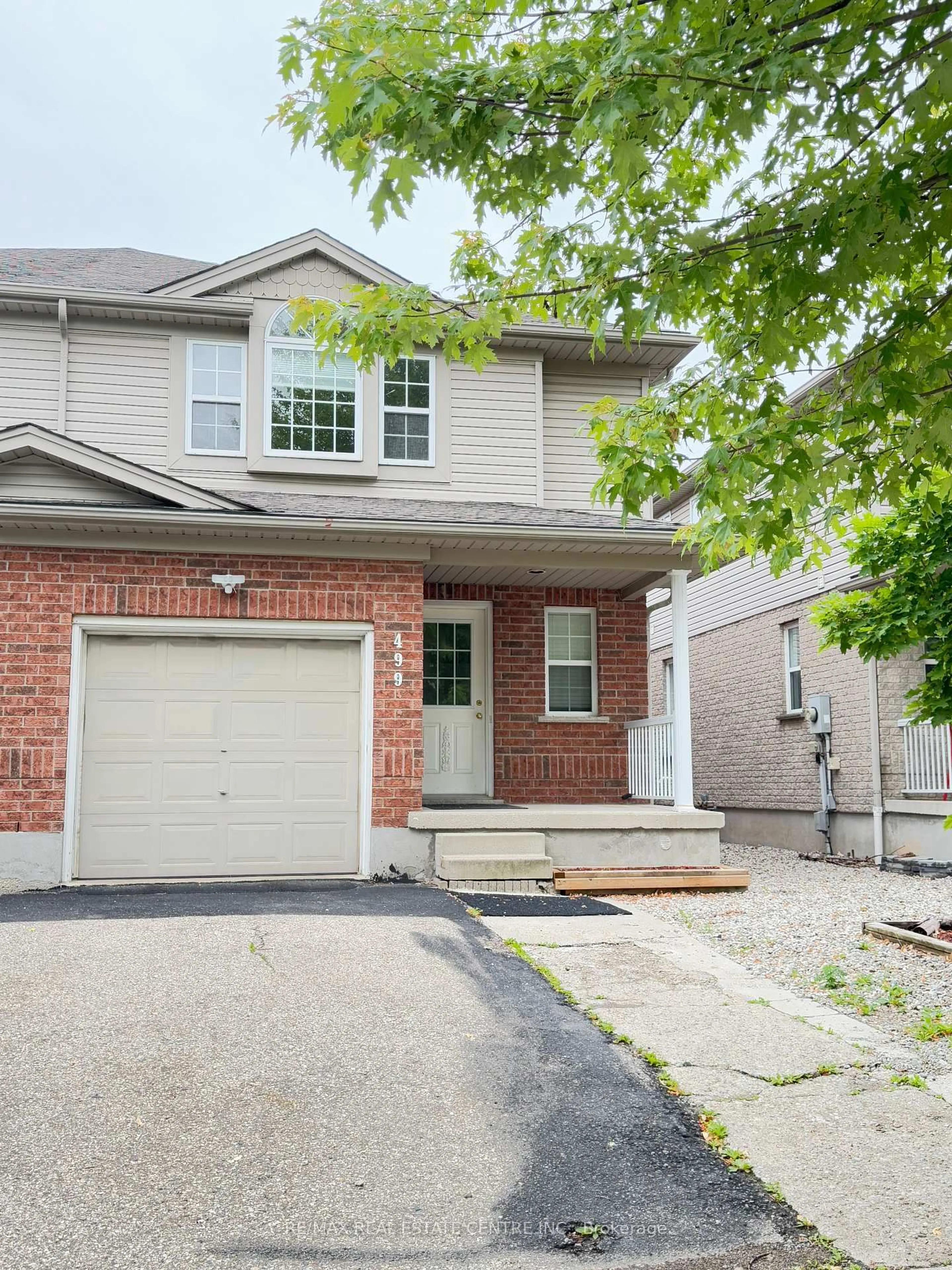 Home with brick exterior material, street for 499 Dansbury Dr, Waterloo Ontario N2K 4K8