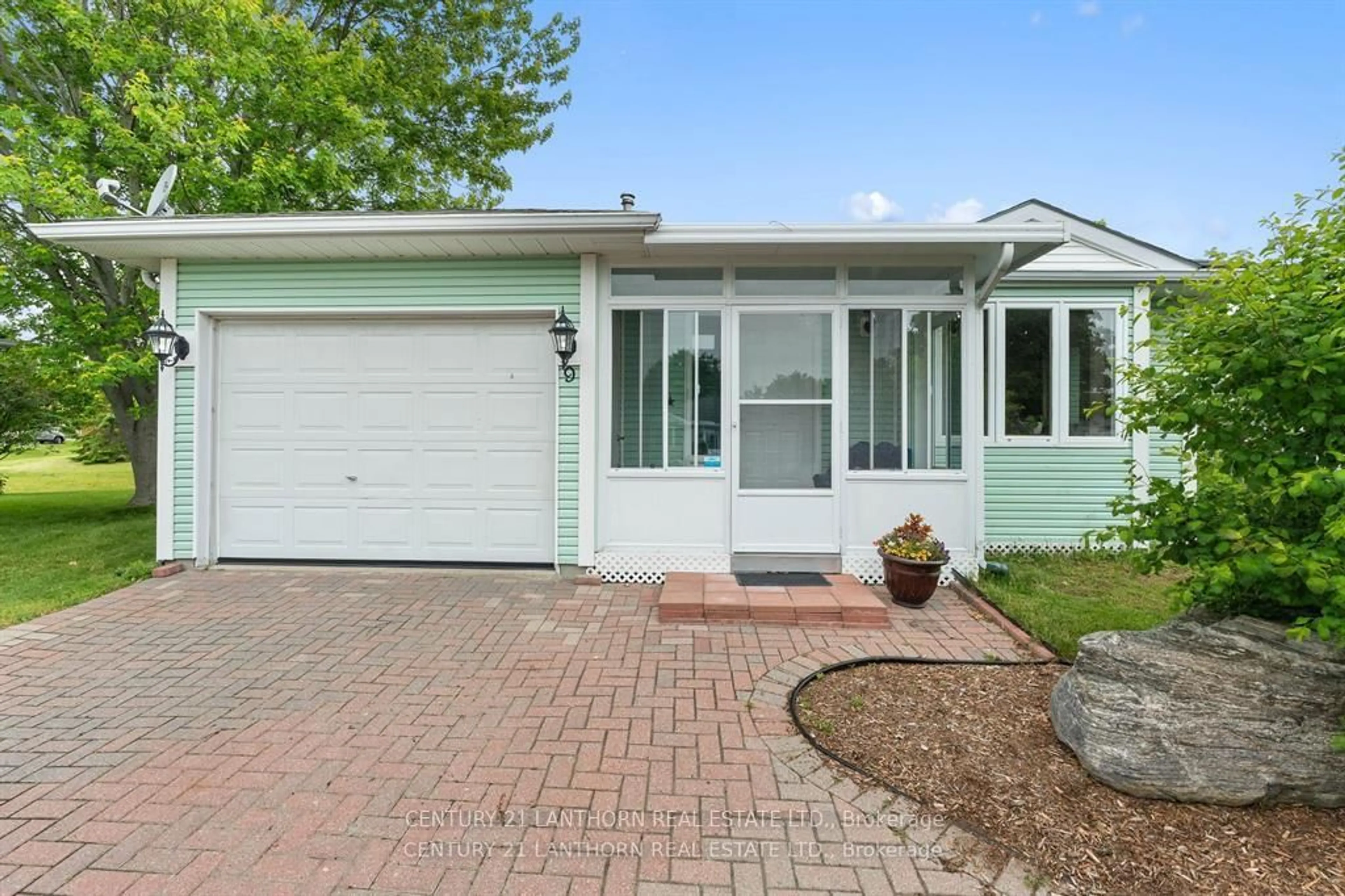 Home with vinyl exterior material, street for 9 Reynolds Pl, Prince Edward County Ontario K0K 3L0