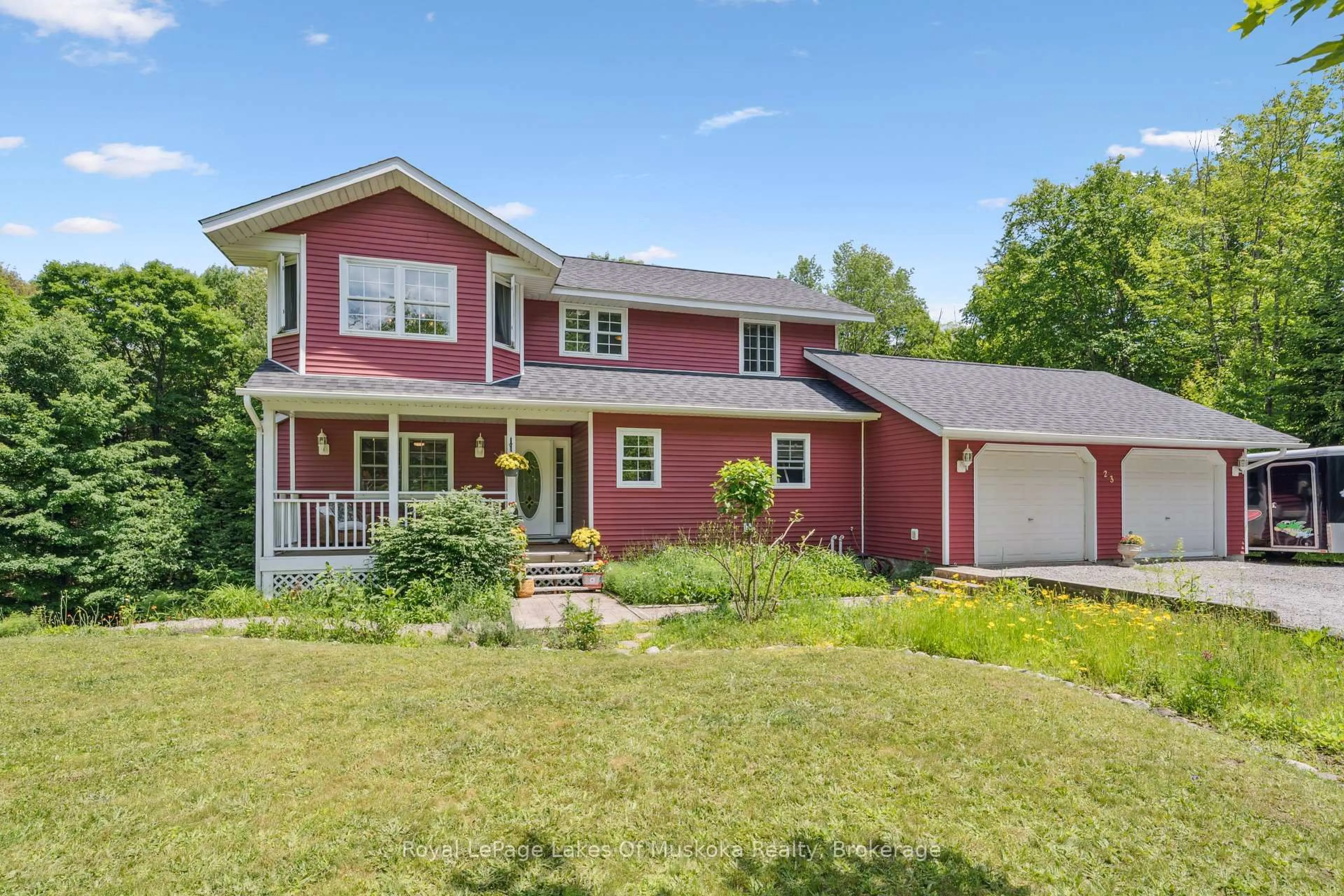 Home with vinyl exterior material, street for 23 Northwoods Dr, Huntsville Ontario P0B 1L0