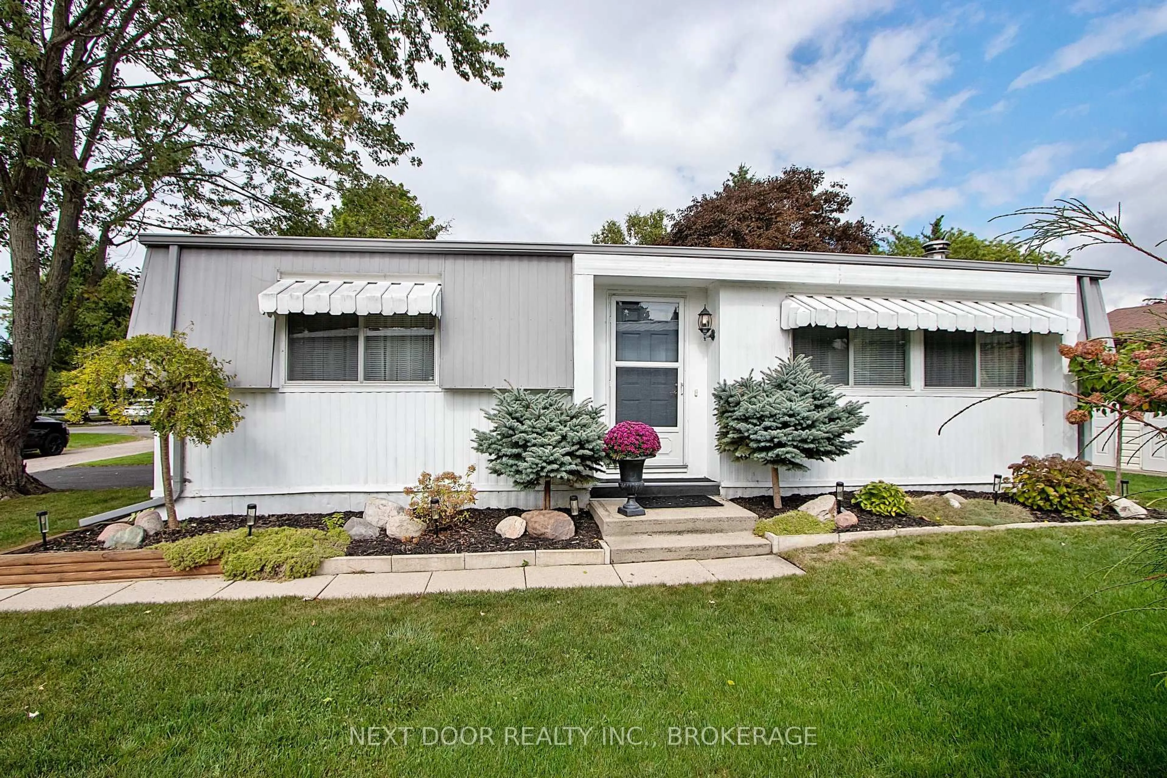 Home with vinyl exterior material, street for 208 Biltmore Dr, South Huron Ontario N0M 1T0