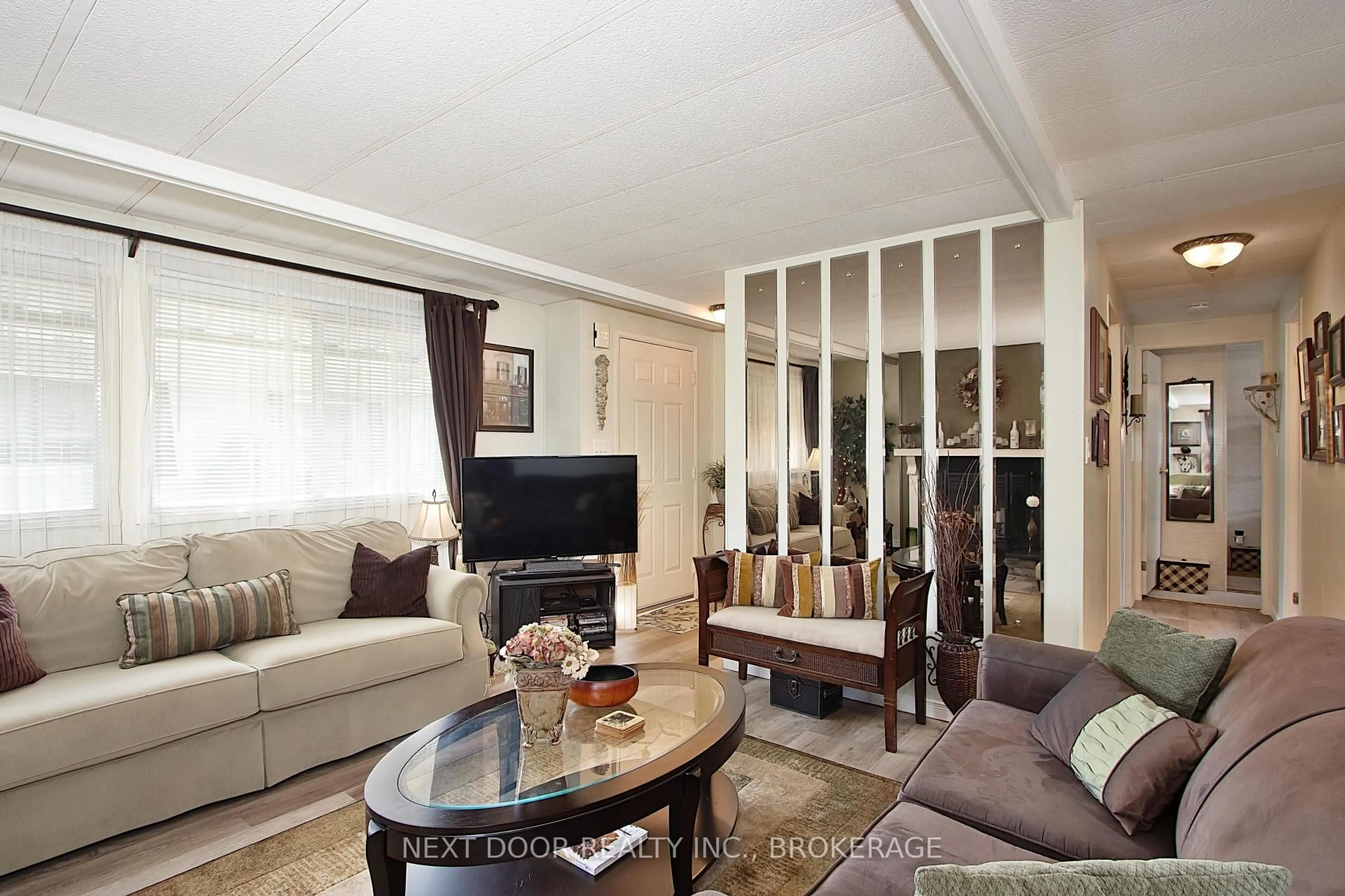 Living room with furniture, wood/laminate floor for 208 Biltmore Dr, South Huron Ontario N0M 1T0