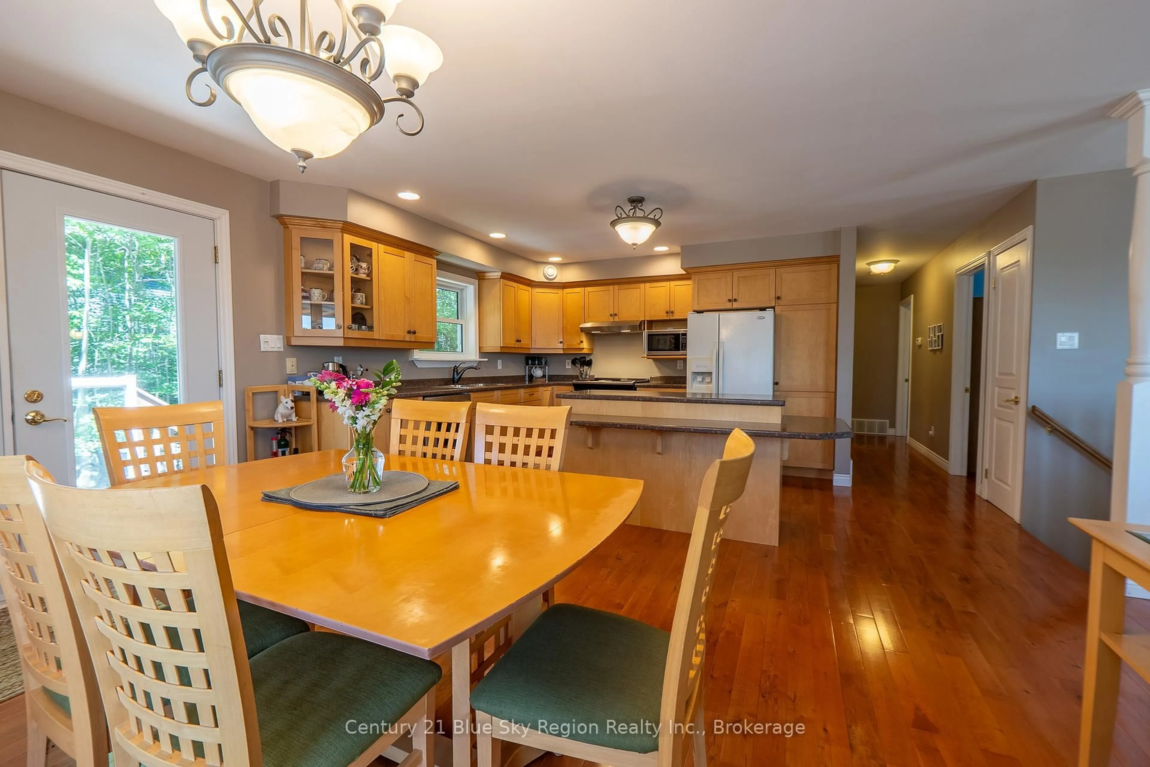 Open concept kitchen, wood/laminate floor for 38 Pleasantview Pl, Callander Ontario P0H 1H0
