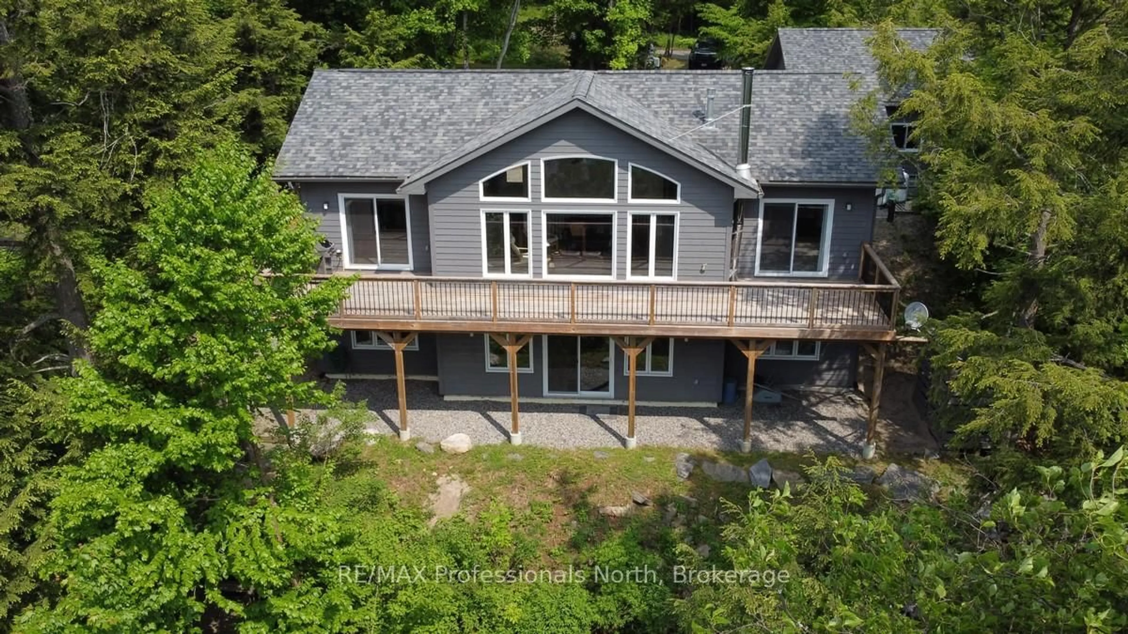 A pic from outside/outdoor area/front of a property/back of a property/a pic from drone, water/lake/river/ocean view for 5997 Kennisis Lake Rd, Dysart et al Ontario K0M 1S0