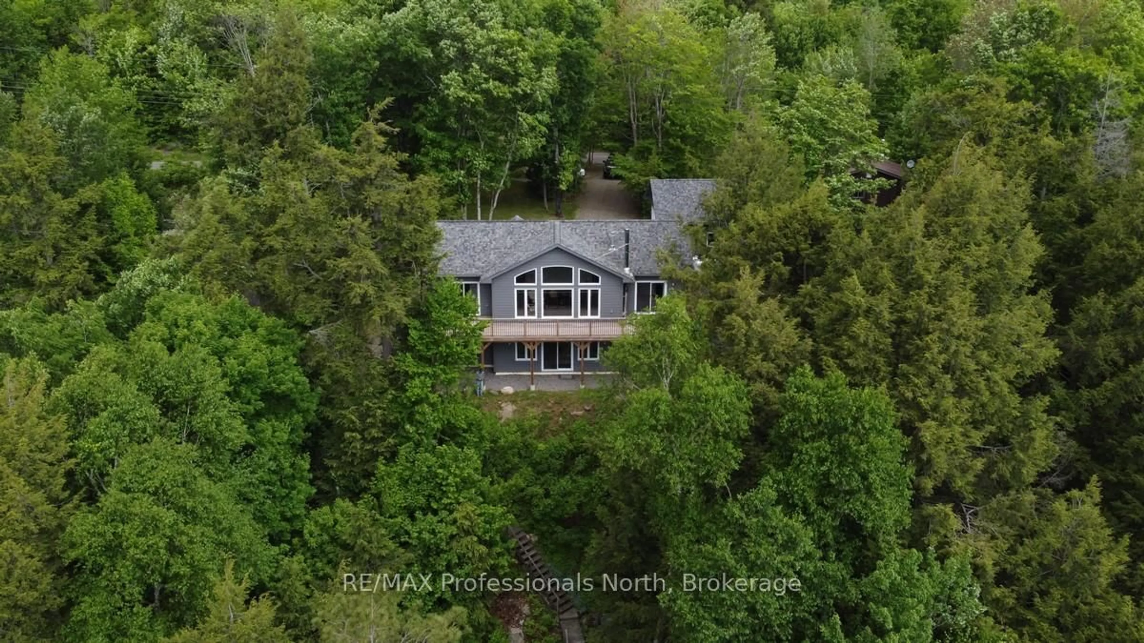 A pic from outside/outdoor area/front of a property/back of a property/a pic from drone, water/lake/river/ocean view for 5997 Kennisis Lake Rd, Dysart et al Ontario K0M 1S0