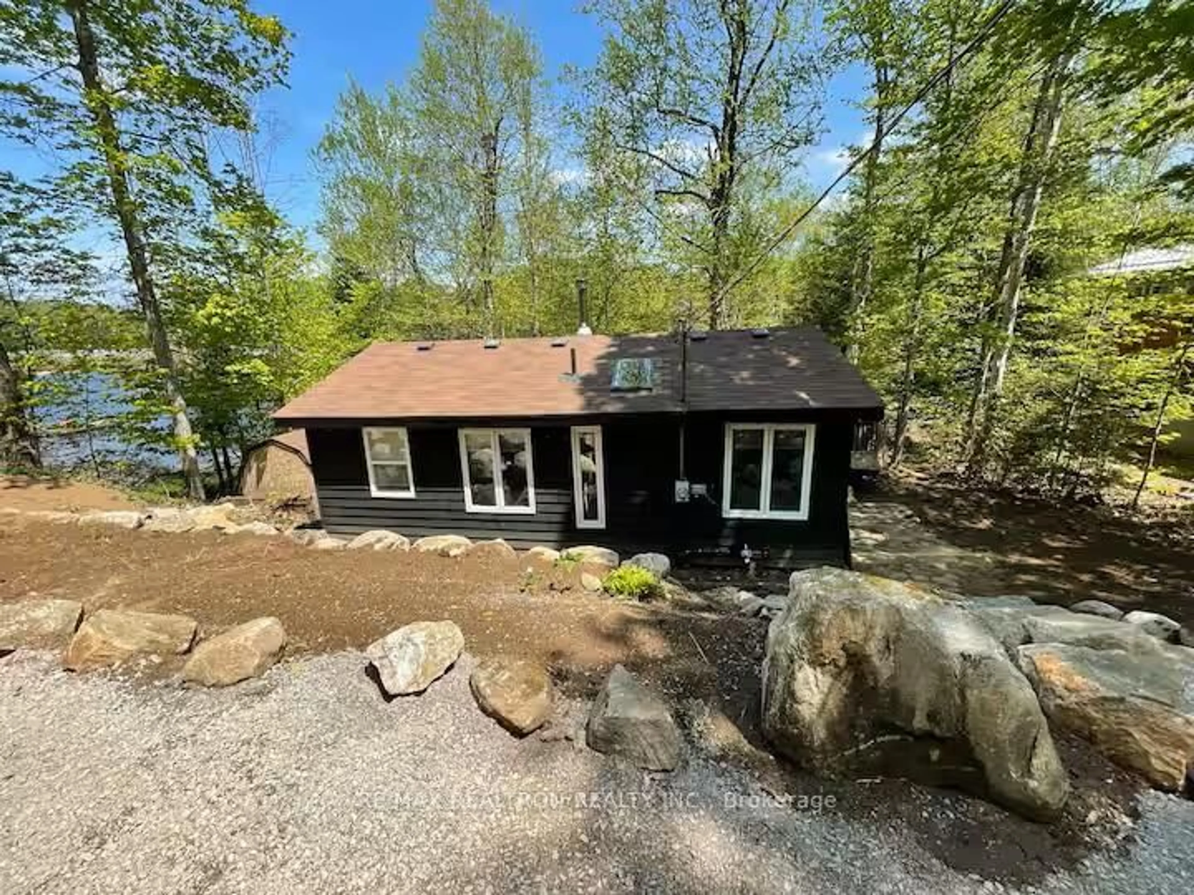A pic from outside/outdoor area/front of a property/back of a property/a pic from drone, water/lake/river/ocean view for 1053 Esson Creek Lane, Highlands East Ontario K0L 3C0